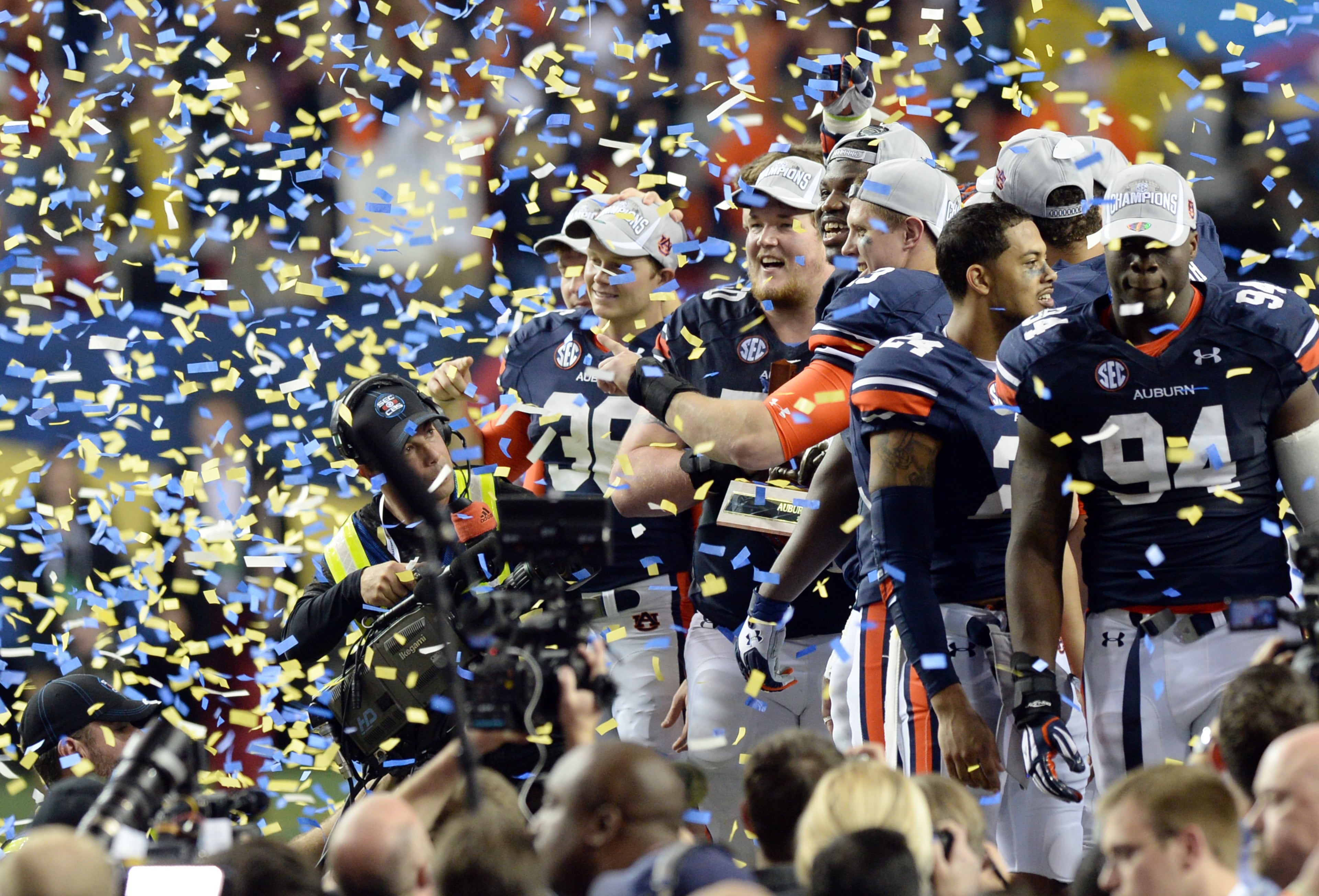 Auburn Tigers players celebrate their win over the Missouri Tigers during the SEC Championship game at Georgia Dome on Saturday, December 7, 2013. Auburn Tigers won 59-42. HYOSUB SHIN / HSHIN@AJC.COM