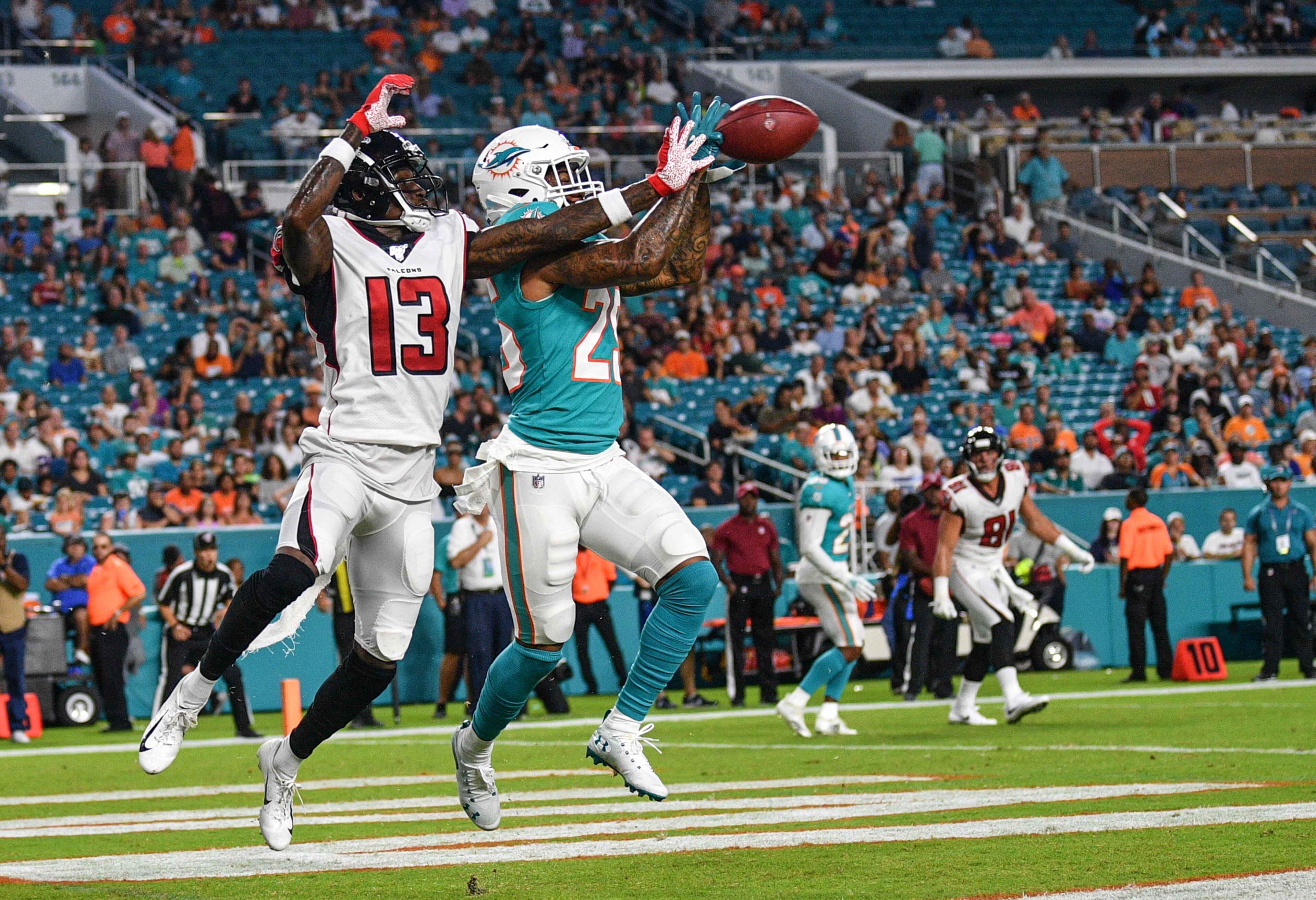 Bobby McCain #28 of the Miami Dolphins deflects the pass against Christian Blake #13 of the Atlanta Falcons in the first quarter during a preseason game at Hard Rock Stadium on August 8, 2019 in Miami, Florida. (Photo by Mark Brown/Getty Images)