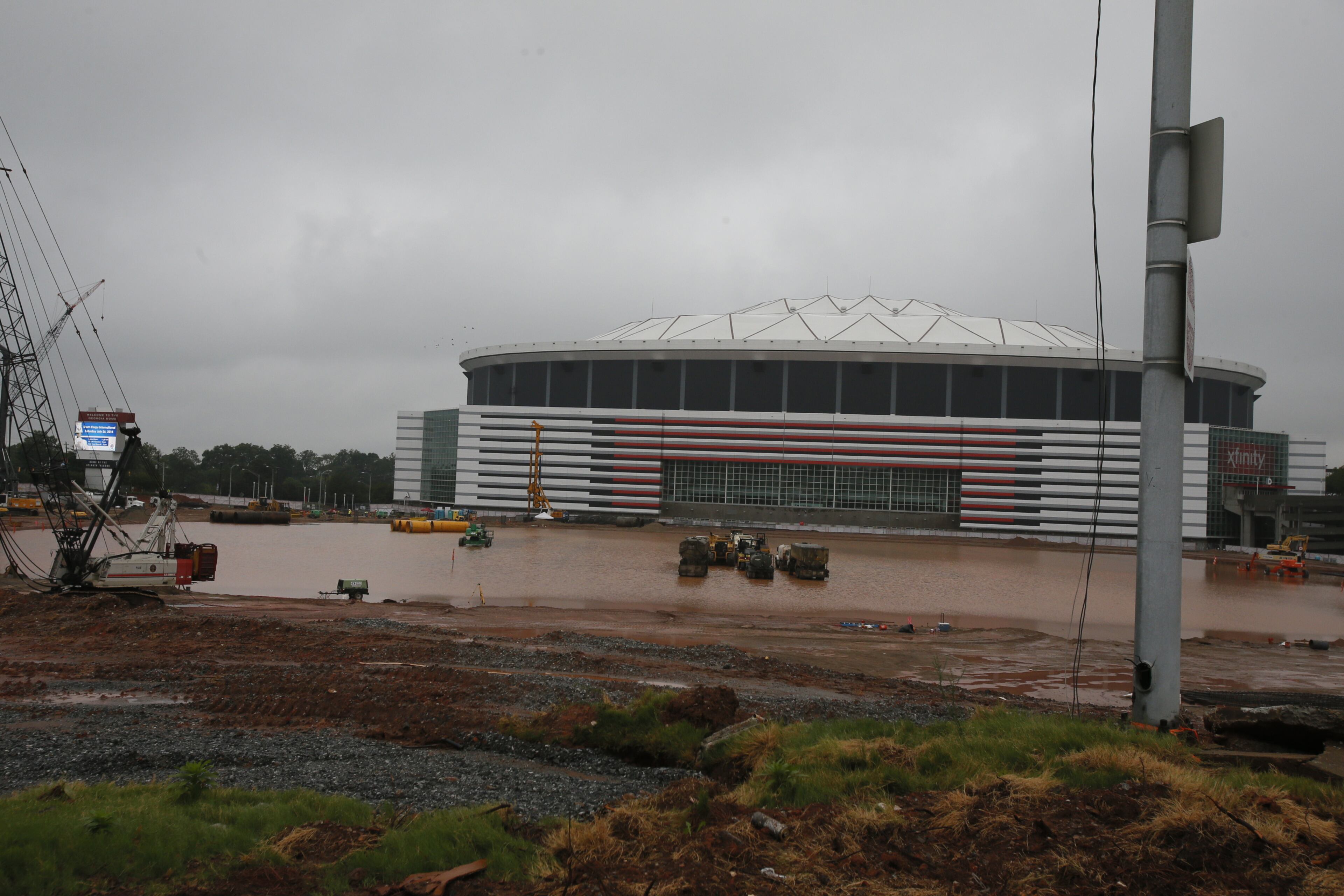 The rain that persisted through much of the weekend continued into Monday, and forecasters are predicting a 30 to 40 percent chance of rain all week. The site of the new Falcon's stadium is just one of the locations that has been affected by the weather. BOB ANDRES/BANDRES@AJC.COM