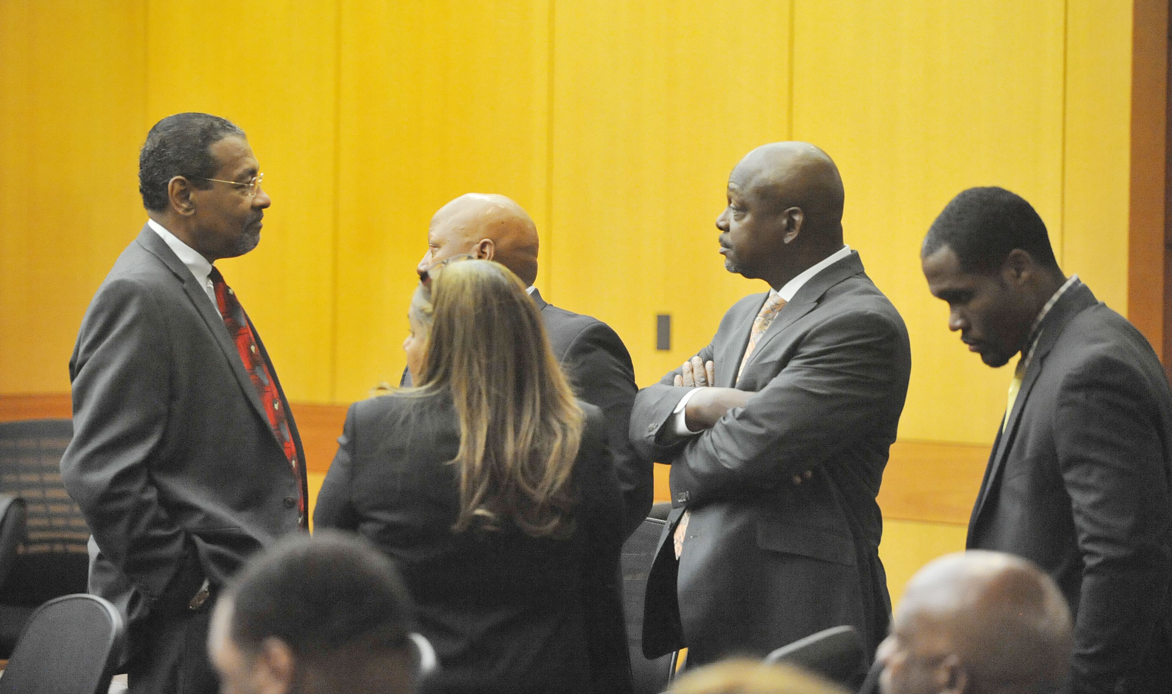 Defense attorneys George Lawson, Kevin Franks, Tamara Mann, Akil Secret and Gerald Griggs talk before the start of court on Tuesday. Sentencing continues for 10 of the 11 defendants convicted of racketeering and other charges in the Atlanta Public Schools test-cheating trial before Judge Jerry Baxter in Fulton County Superior Court, Tuesday, April 14, 2015. (Atlanta Journal-Constitution, Kent D. Johnson, Pool)