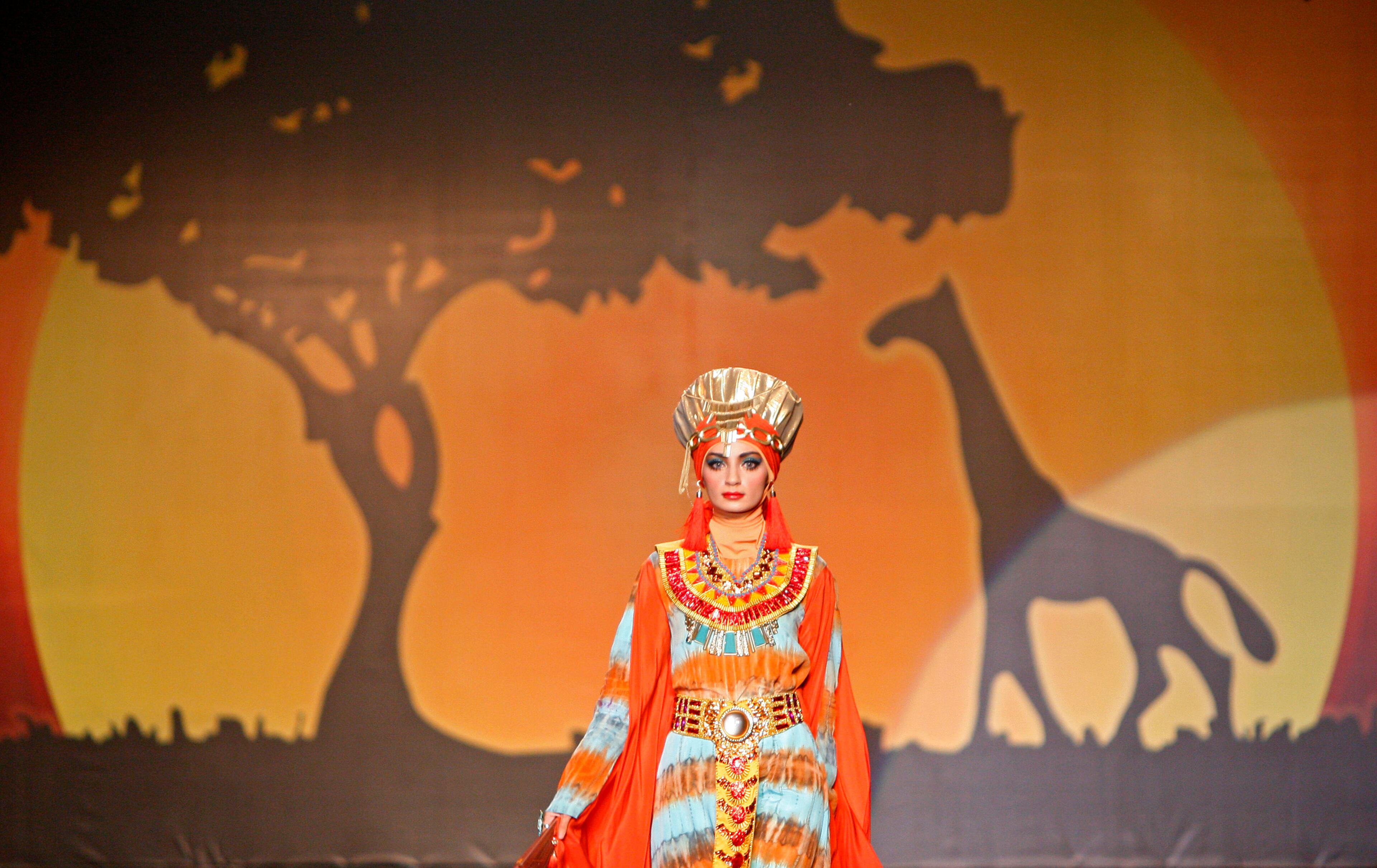 A model presents a creation by designer Dian Pelangi from Indonesia during the Islamic Fashion Festival in Kuala Lumpur, Malaysia, Monday, Nov. 5, 2012.