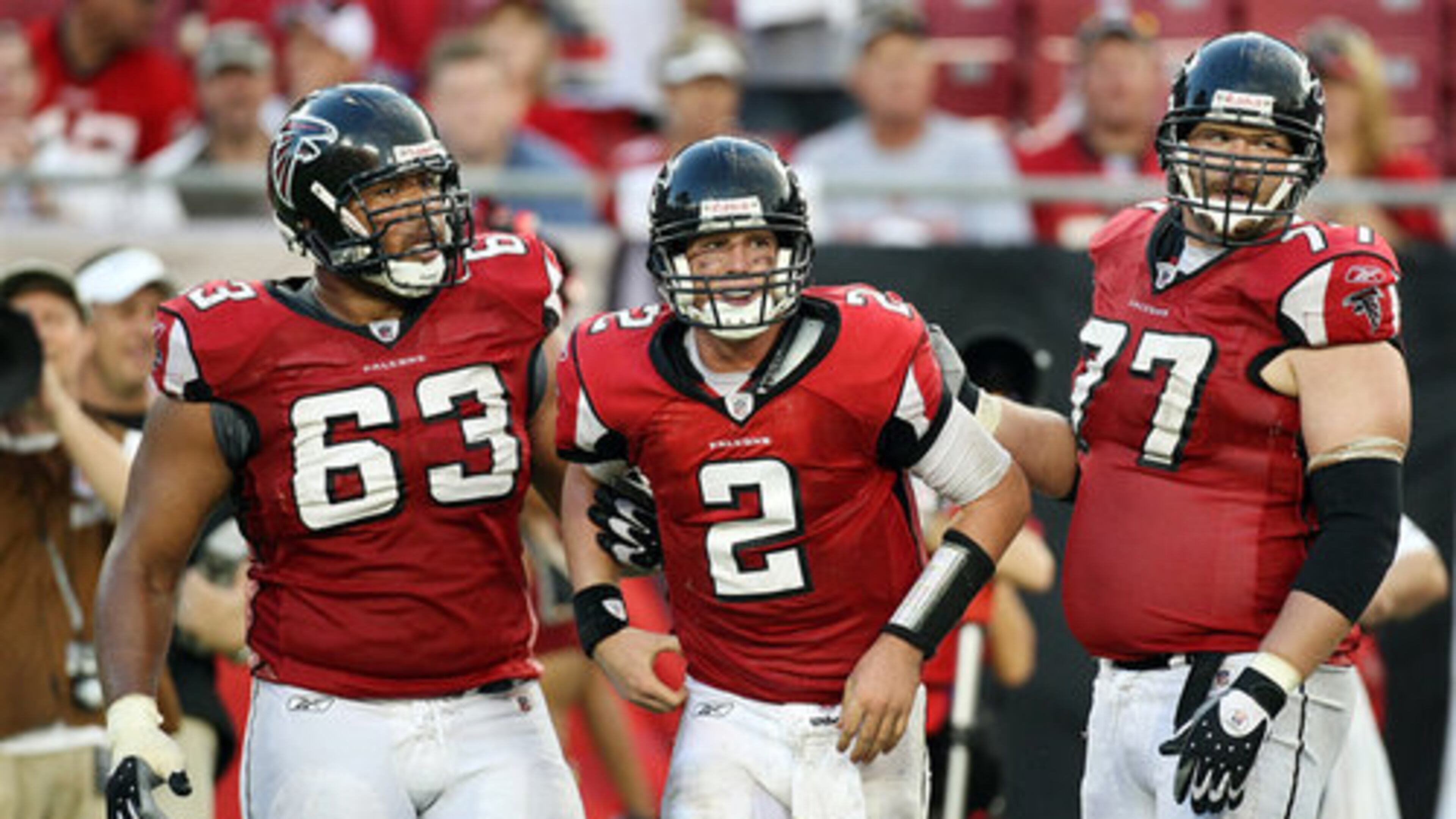 Falcons guards Justin Blalock (left) and Tyson Clabo help Ryan to his feet after the hit against Tampa Bay in 2015. All three made the Falcons' All-Decade (2010-19) team.