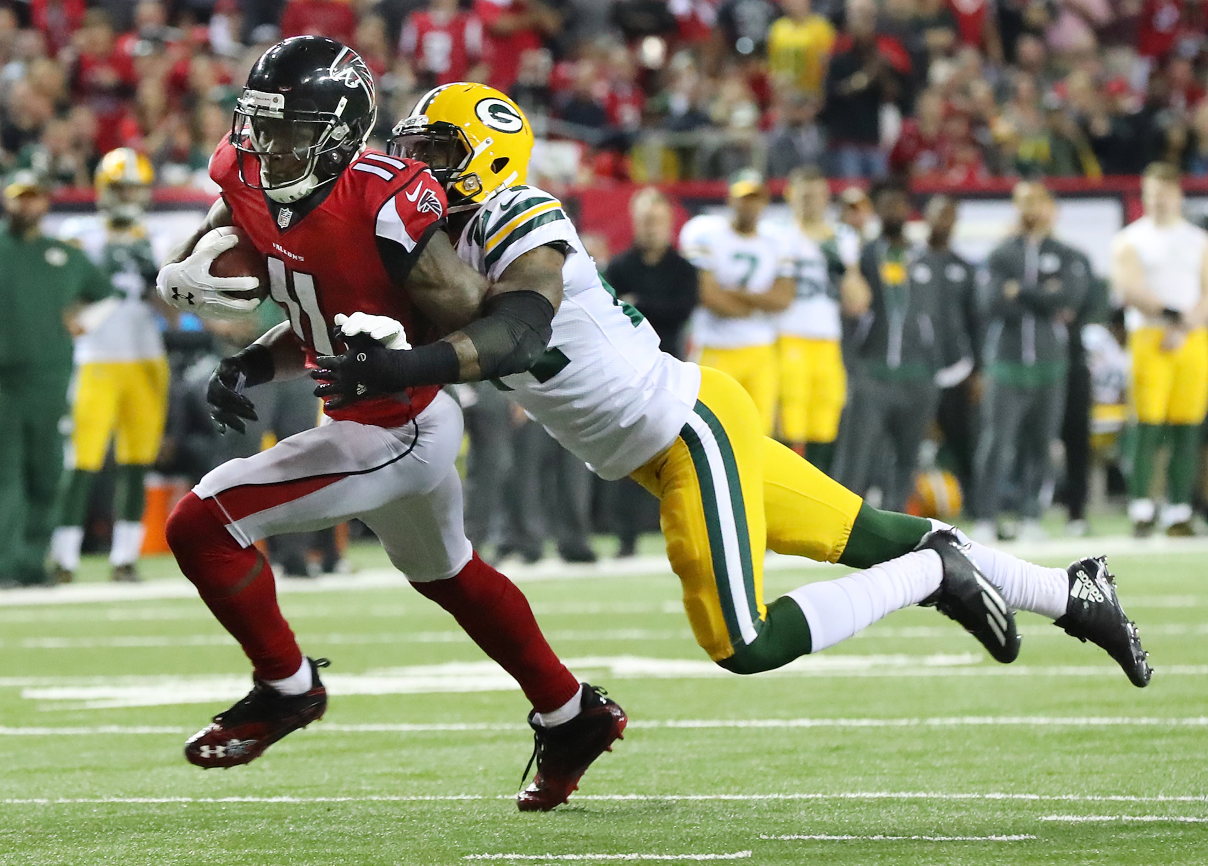 January 22, 2017, Atlanta: Julio Jones makes a first down catch against Packers Quinten Rollins in the NFL football NFC Championship game on Sunday, Jan. 22, 2017, in Atlanta. Curtis Compton/ccompton@ajc.com