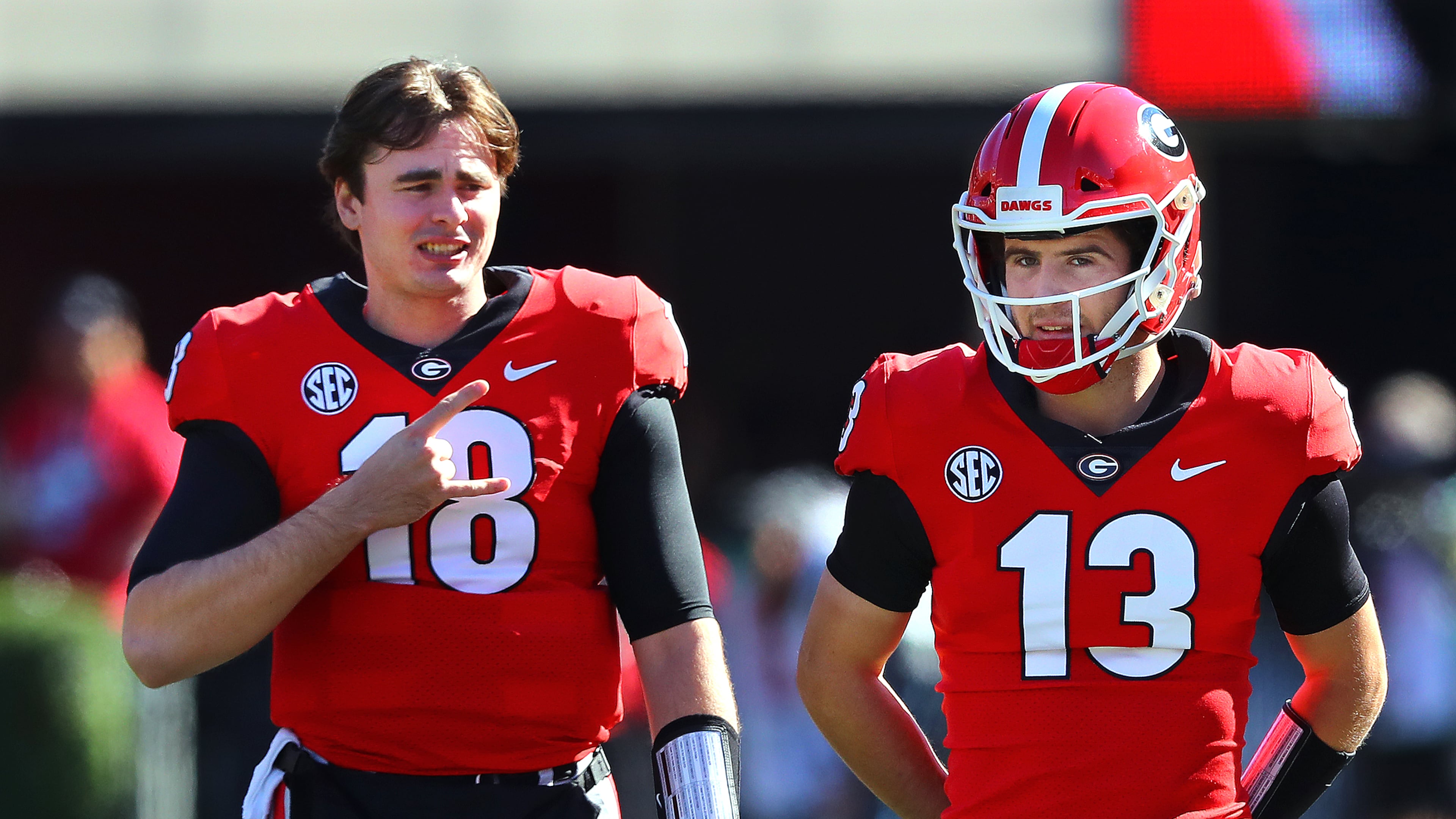 112021 Athens: Georgia quarterbacks JT Daniels and Stetson Bennett confer on the sidelines during the first half against Charleston Southern in a NCAA college football game on Saturday, Nov. 20, 2021, in Athens. “Curtis Compton / Curtis.Compton@ajc.com”