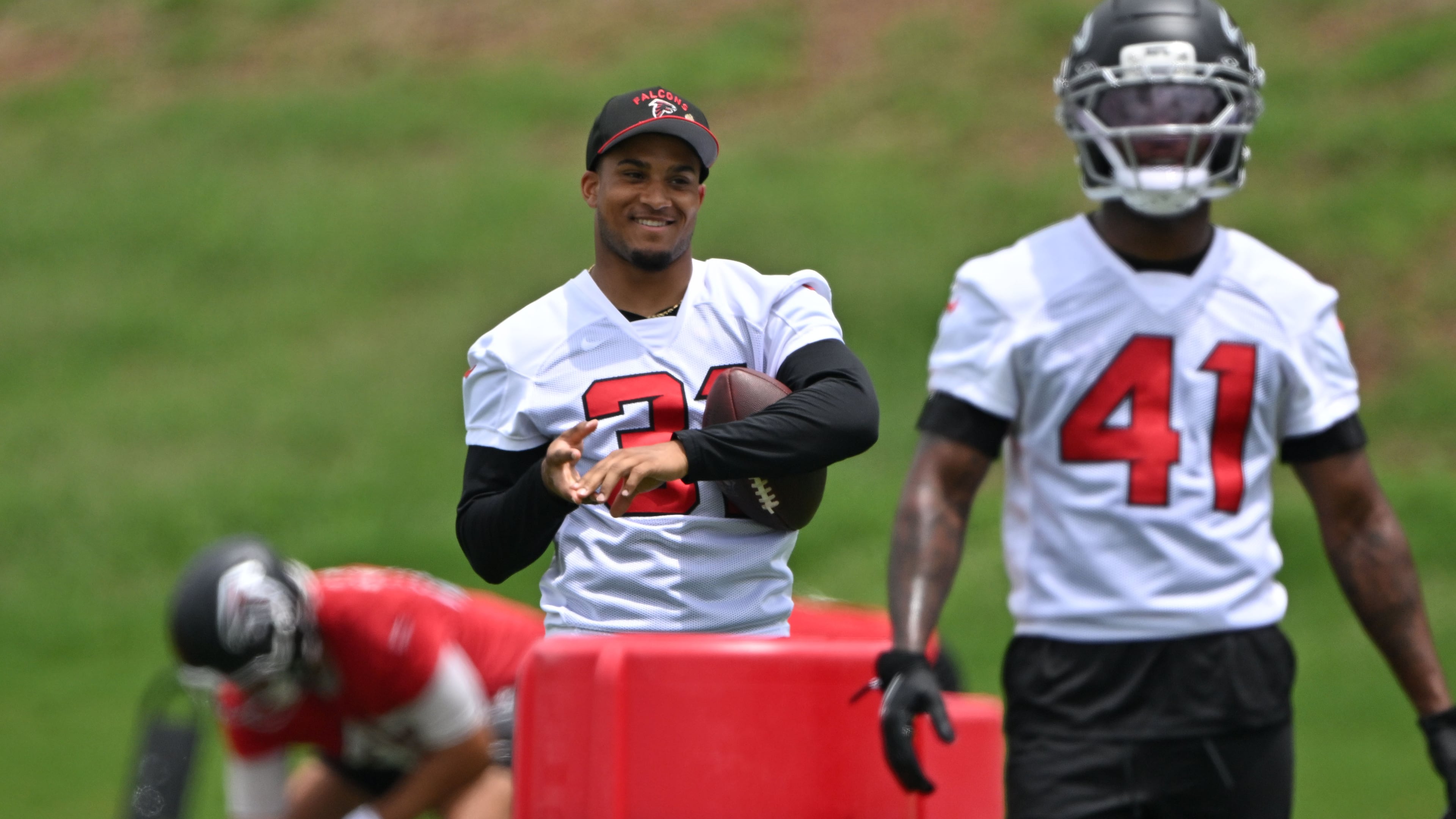 Atlanta Falcons safety Xavier Watts (center) watches during an OTA workout at Atlanta Falcons Training Facility on Wednesday, May 27, 2026, in Flowery Branch. (Hyosub Shin/AJC)