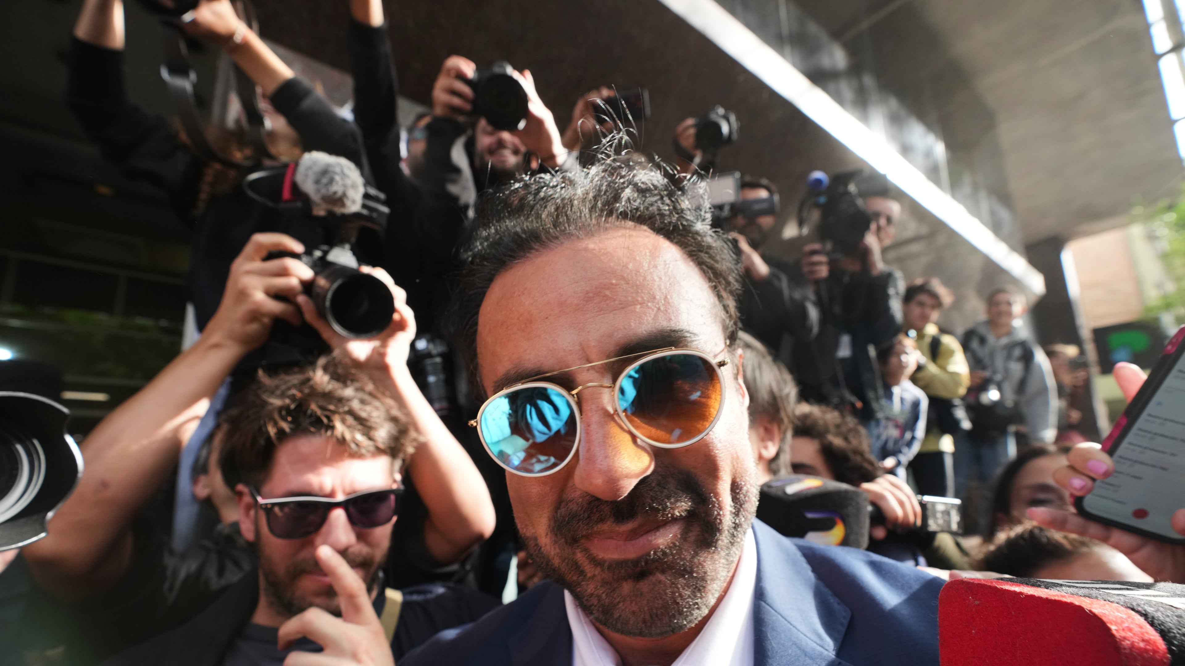 Physician Leopoldo Luque arrives to court to attend the first day of his trial with the medical team that treated the late soccer star Diego Maradona, to face charges of alleged homicide by negligence in San Isidro, Argentina, Tuesday, April 14, 2026. (AP Photo/Rodrigo Abd)