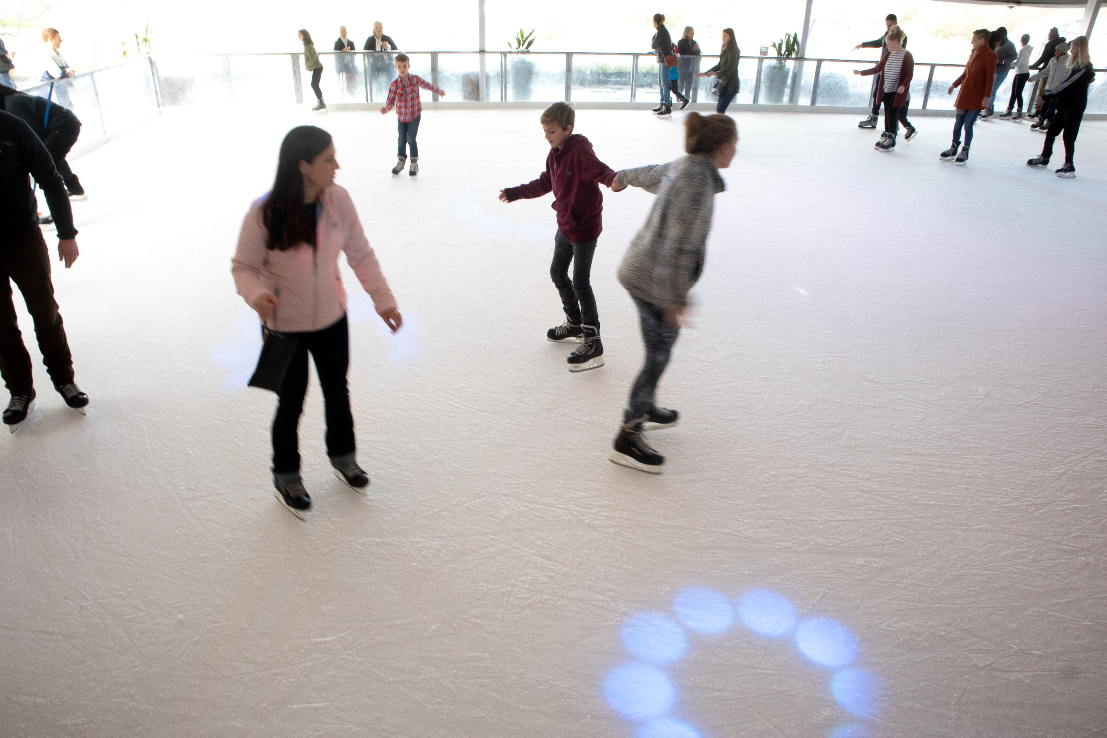 People make their way around the Ice skating rink at Skyline Park on top of Ponce City Market Sunday, December 23, 2018. STEVE SCHAEFER / SPECIAL TO THE AJC