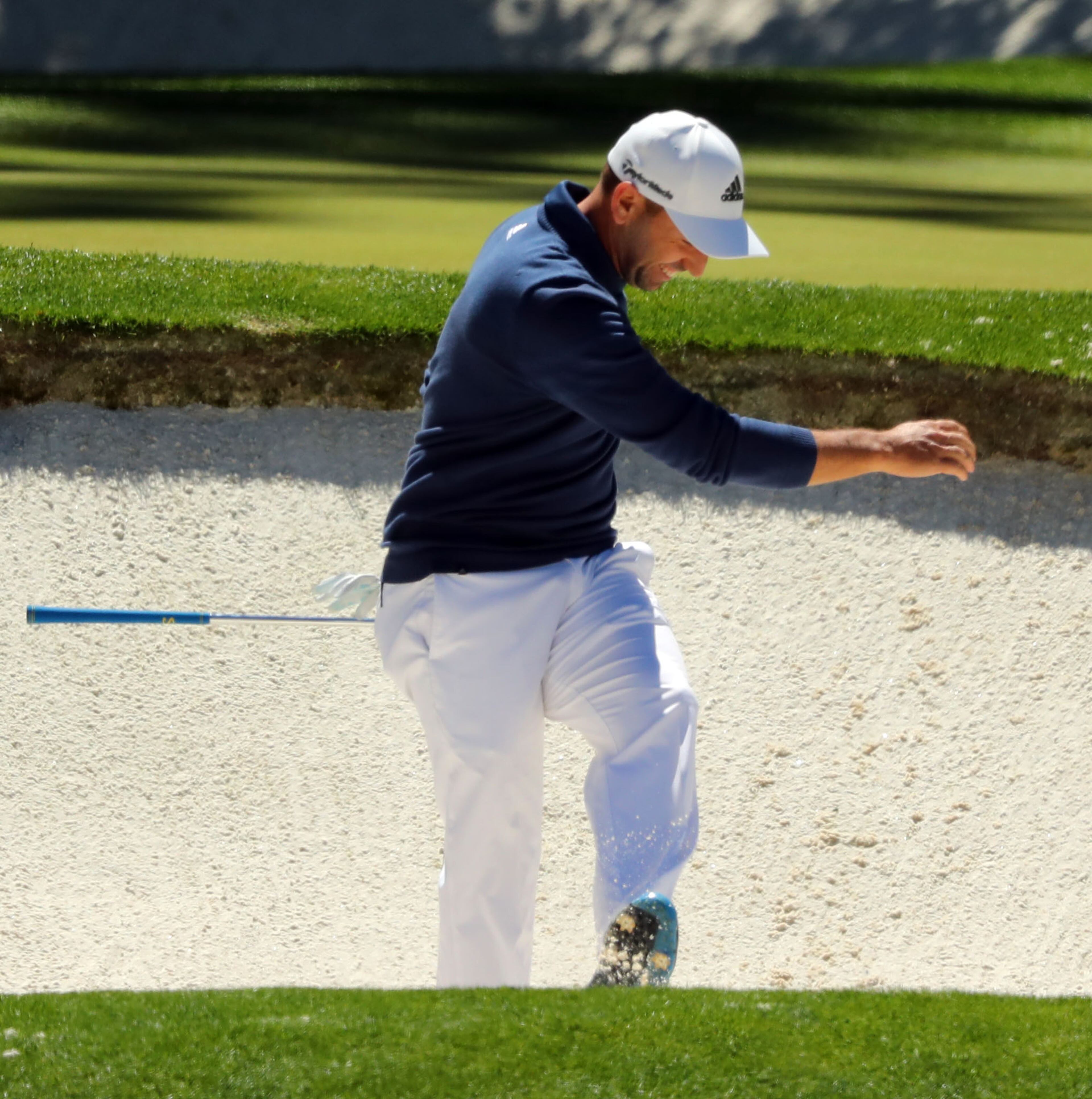 April 7, 2017 AUGUSTA Sergio Garcia kicks the edge of the trap after nearly chipping in for a birdie from the bunker on the 12th hole. Play begins in the second round of the 81st Masters tournament at the Augusta National Golf Club, Friday April 7, 2017. CURTIS COMPTON/ AJC