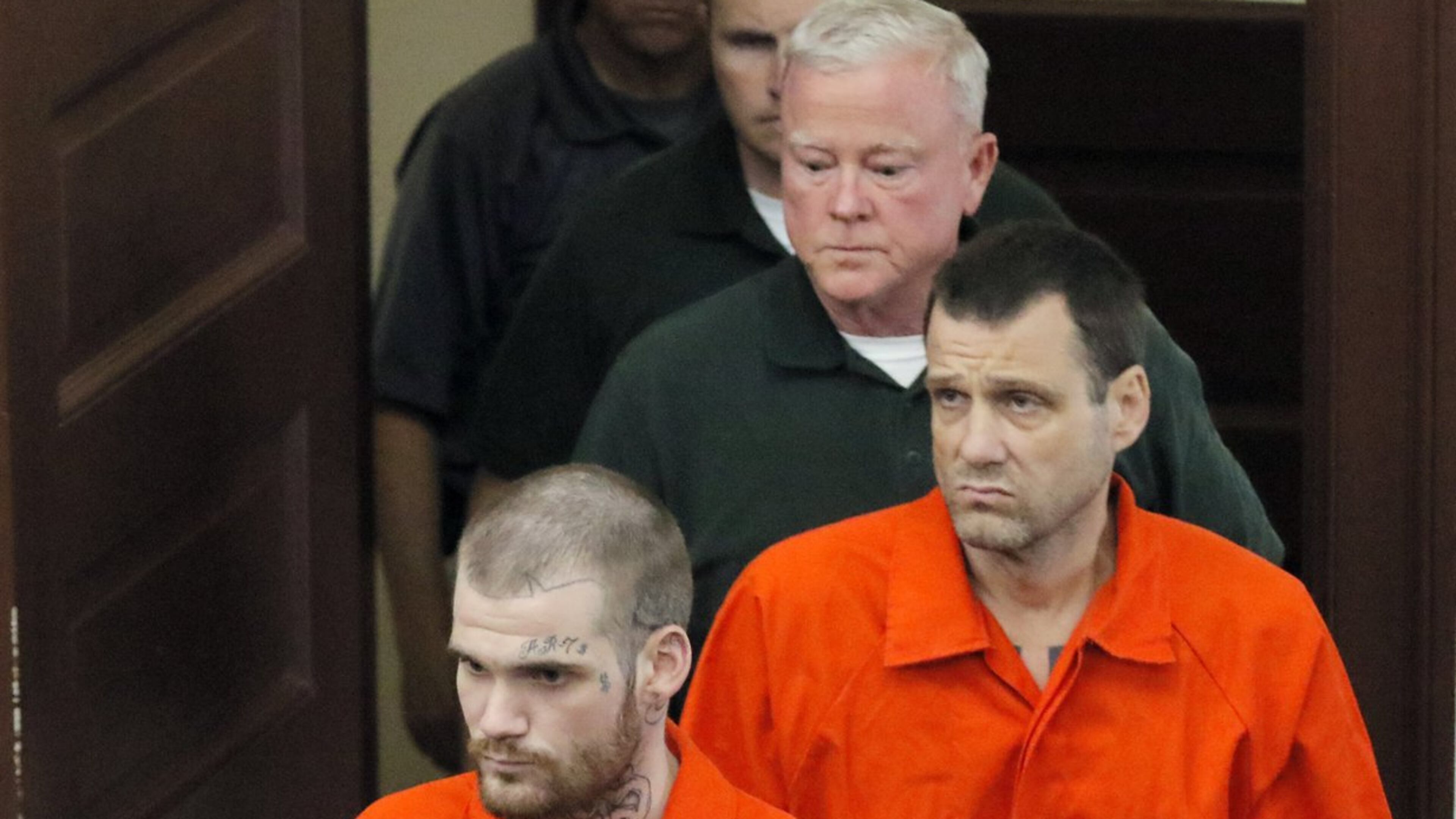 Ricky Dubose (front) and Donnie Rowe enter the Putnam County courthouse on June 21, 2017. Dubose and Rowe have been charged with killing two guards in an escape from a prison bus. A hearing is scheduled Monday, Feb. 22, 2021, to discuss a request by Rowe's defense team to postpone the trial. (Photo: BOB ANDRES /BANDRES@AJC.COM)