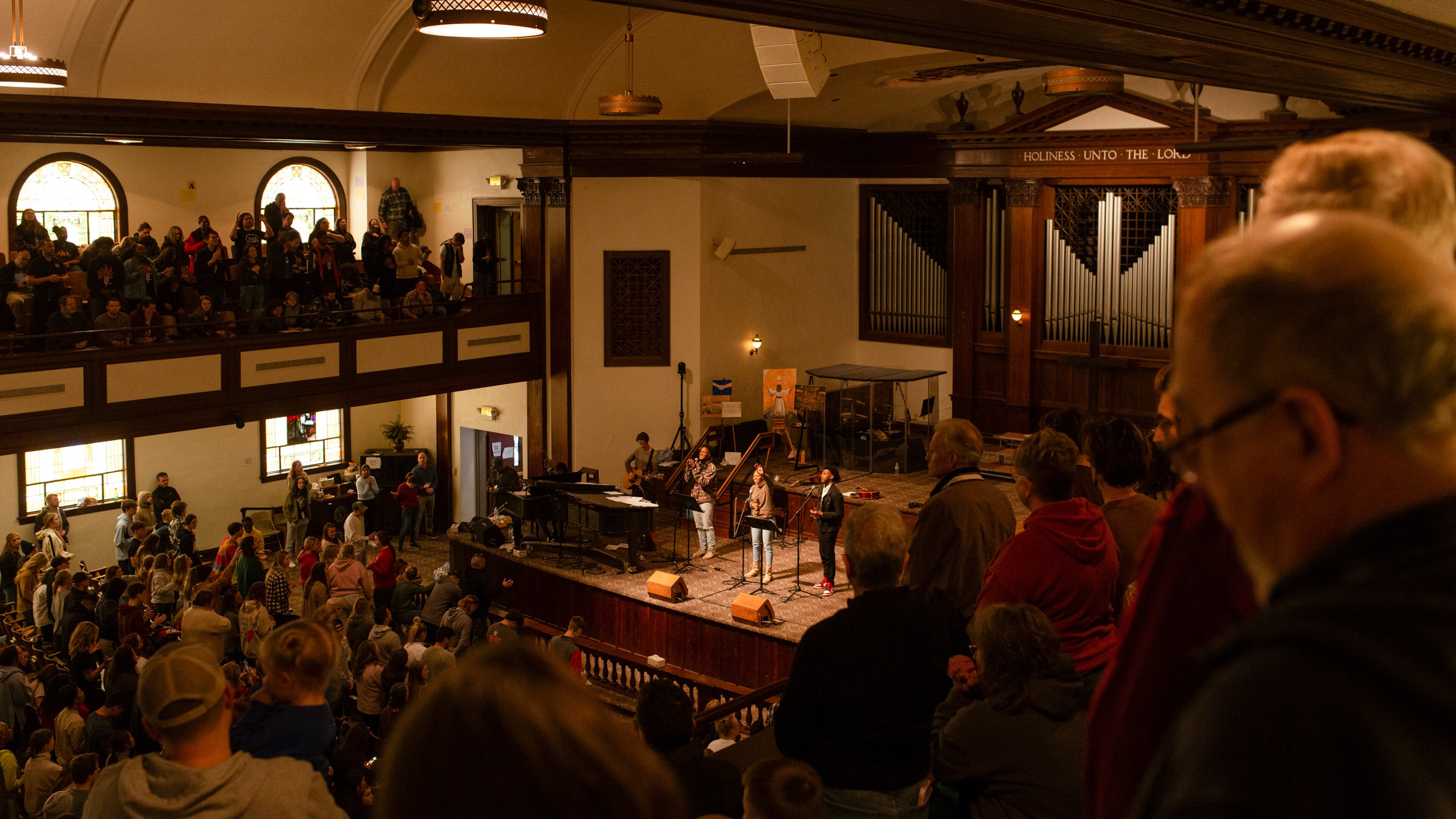 Students leading worship inside Hughes Chapel on the campus of Asbury University in Wilmore, Ky., on Feb. 17, 2023. Over two weeks, more than 50,000 people descended on a small campus chapel to experience the nation’s first major spiritual revival in decades — one driven by Gen Z. (Jesse Barber/The New York Times)