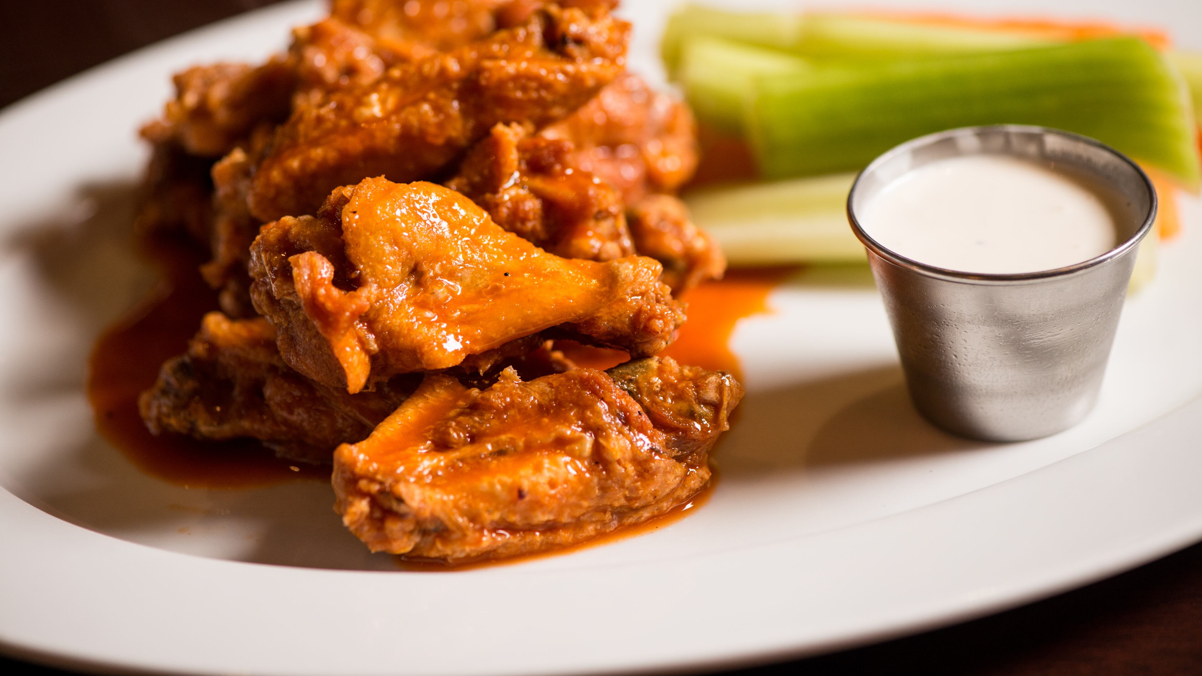 Guests can snack on wings, sesame steak skewers, buffalo chicken sliders, and oysters at Dantanna's while watching game after game.
