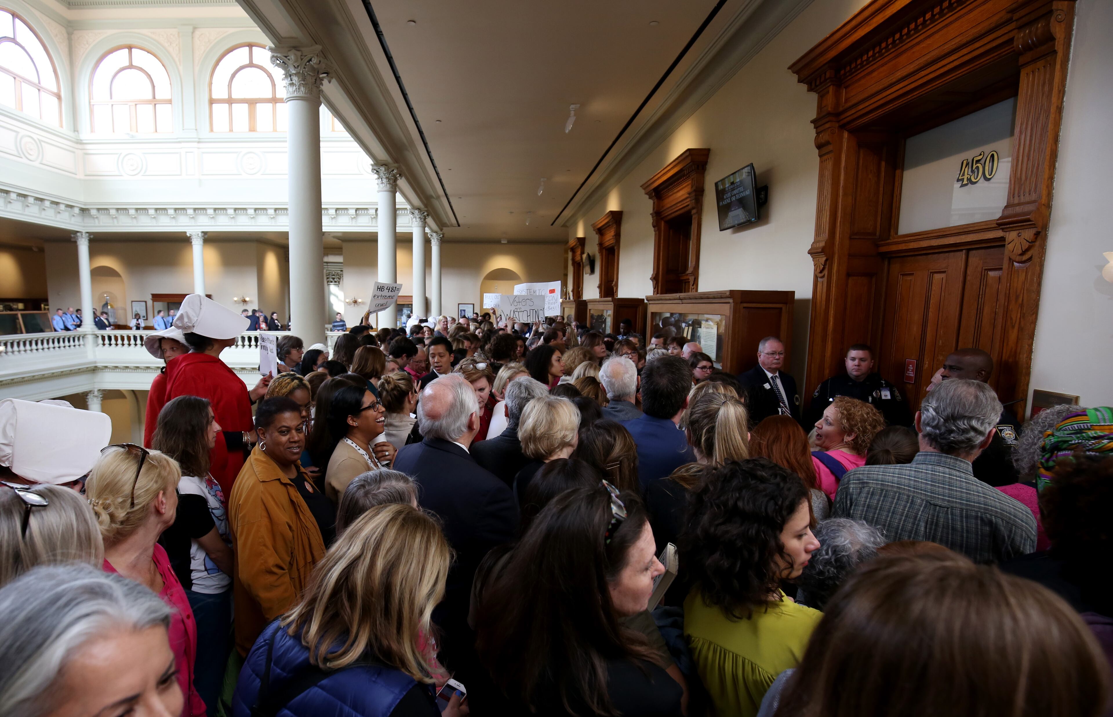 People fill the hallways outside of committee room 450 protesting HB481 where there was a committee meeting about the bill at the Georgia Capitol on Thursday, March 14, 2019 in Atlanta. (JASON GETZ/SPECIAL TO THE AJC)