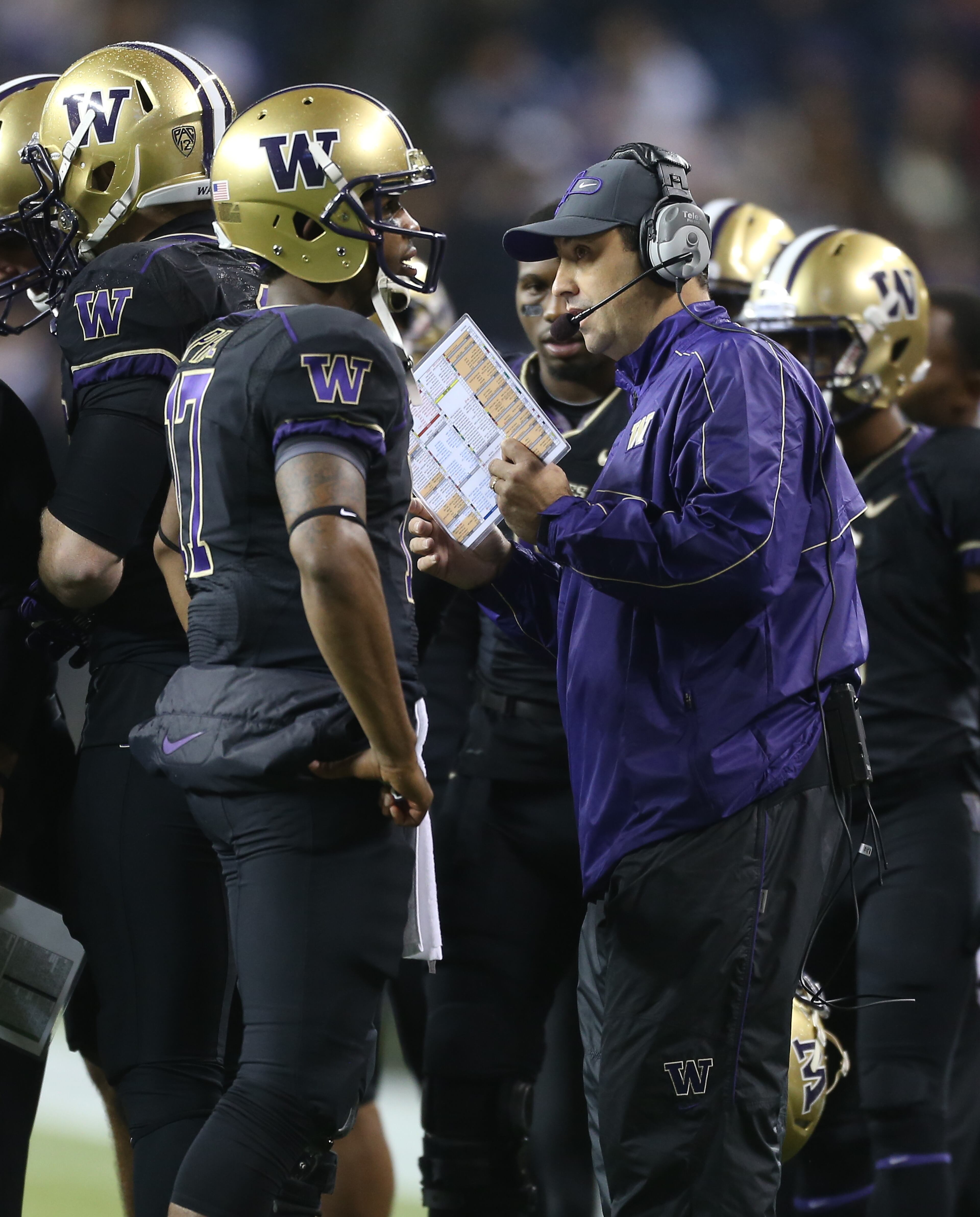 SEATTLE, WA - OCTOBER 27: Head coach Steve Sarkisian of the Washington Huskies talks with quarterback Keith Price #17 during the game against the Oregon State Beavers on October 27, 2012 at CenturyLink Field in Seattle, Washington. The Huskies defeated the Beavers 20-17. (Photo by Otto Greule Jr/Getty Images)