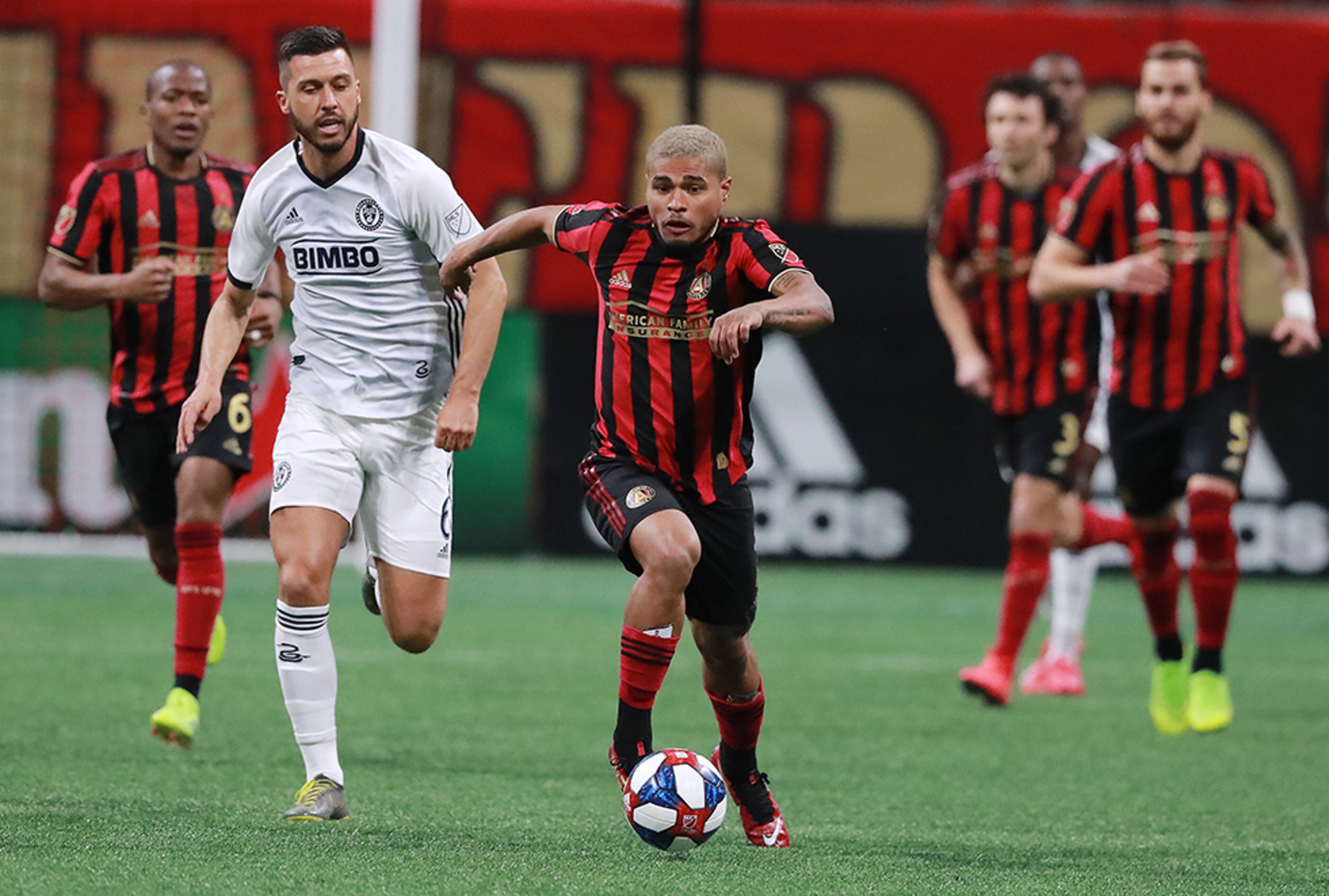 Atlanta United forward Josef Martinez breaks away from Philadelphia Union defender Haris Medunjanin to drive down the pitch during the first half Sunday, March 17, 2019, at Mercedes-Benz Stadium in Atlanta.