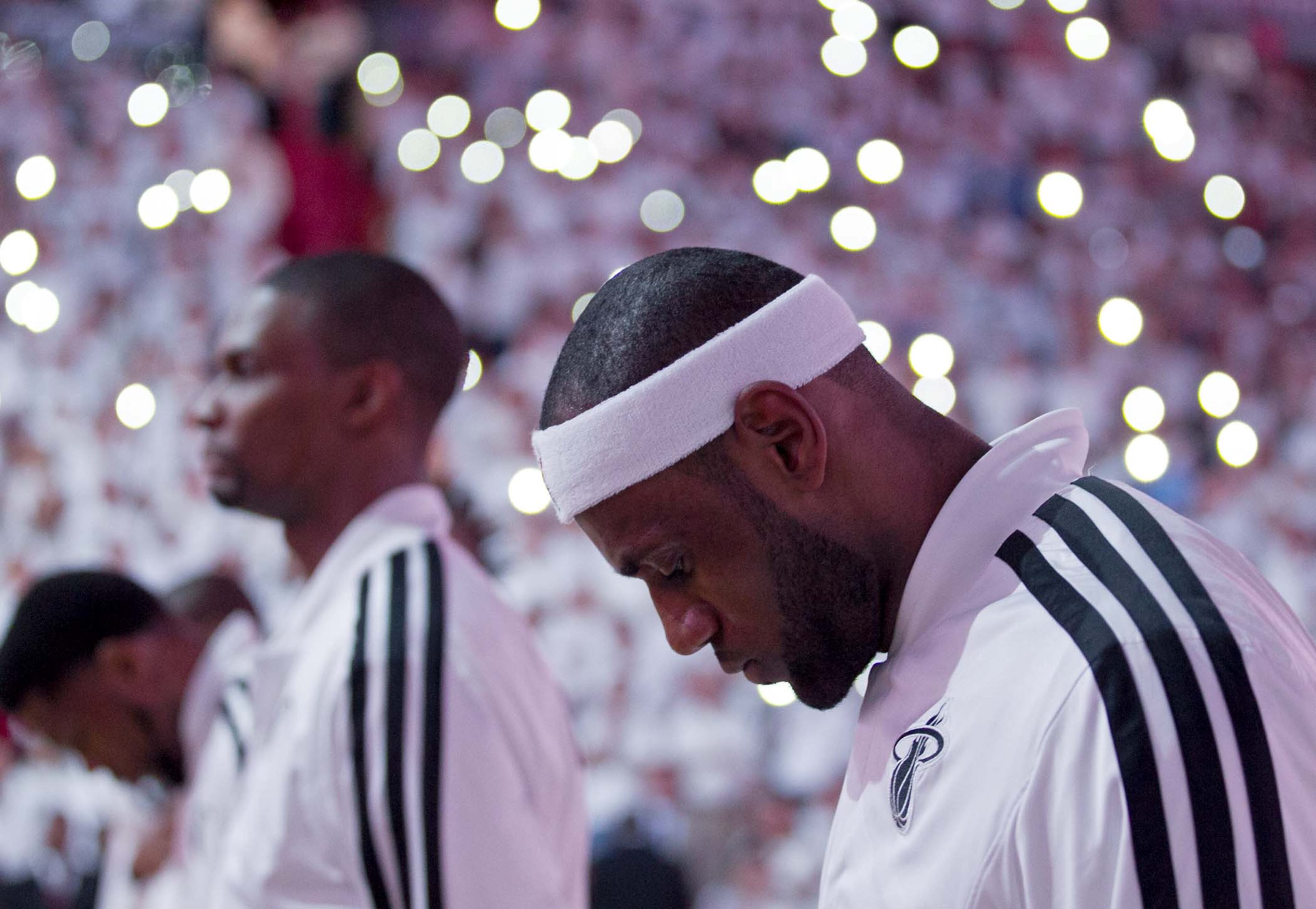 LeBron James listens to the National Anthem prior to the first round playoff game against the Bucks at AmericanAirlines Arena on April 21, 2013. (Allen Eyestone/The Palm Beach Post)