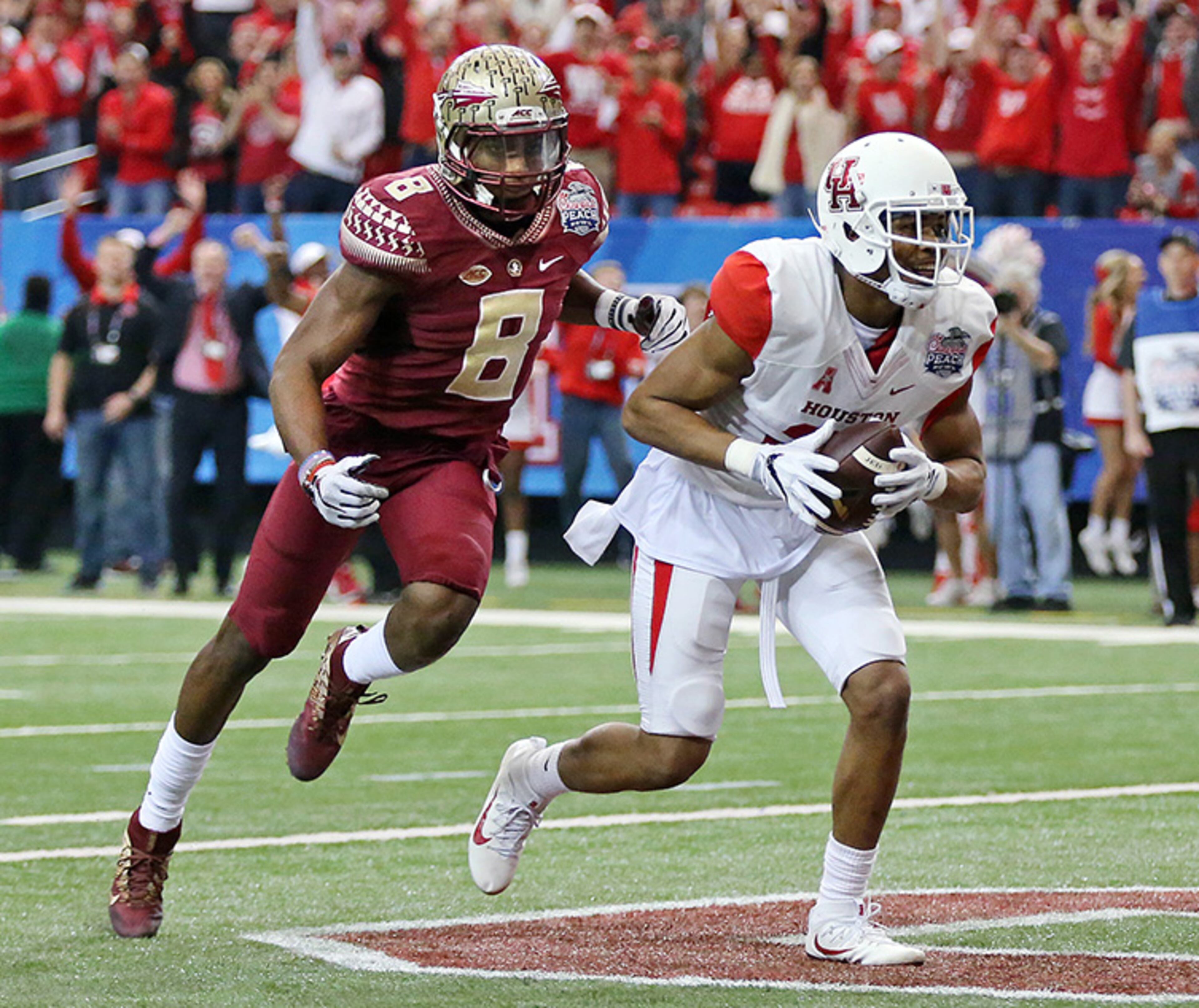 Houston wide receiver Chance Allen catches a touchdown pass past Florida State defensive back Jalen Ramsey to give the Cougars a 14-3 lead in the second quarter of the Chick-fil-A Peach Bowl Thursday, Dec. 31, 2015, at the Georgia Dome in Atlanta.