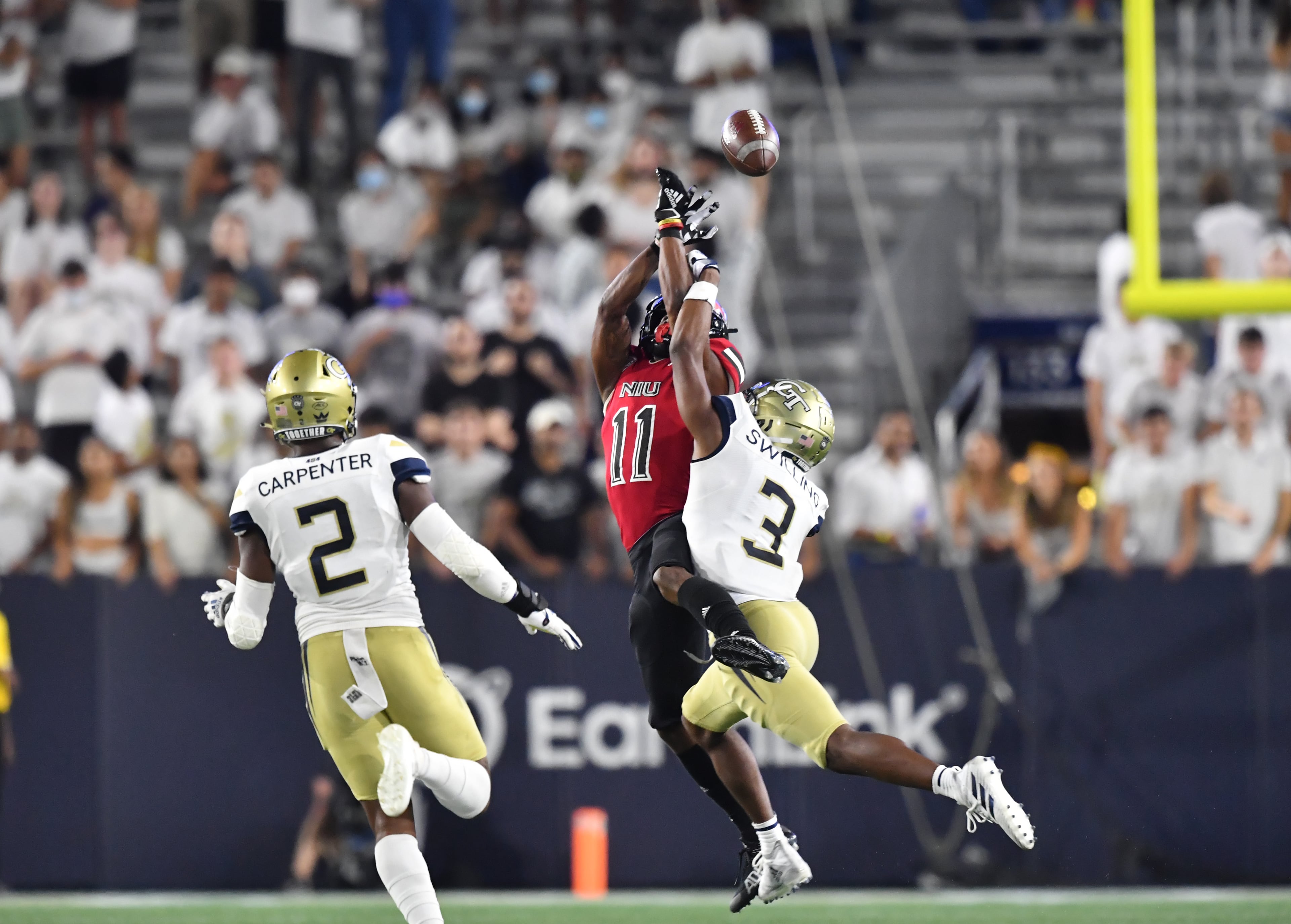 September 4, 2021 Atlanta - Northern Illinois' wide receiver Messiah Travis (11) is not able to catch under pressure from Georgia Tech's defensive back Tre Swilling (3) during the second half of an NCAA college football game at Georgia Tech's Bobby Dodd Stadium in Atlanta on Saturday, September 4, 2021. Northern Illinois won 22-21 over Georgia Tech(Hyosub Shin / Hyosub.Shin@ajc.com)