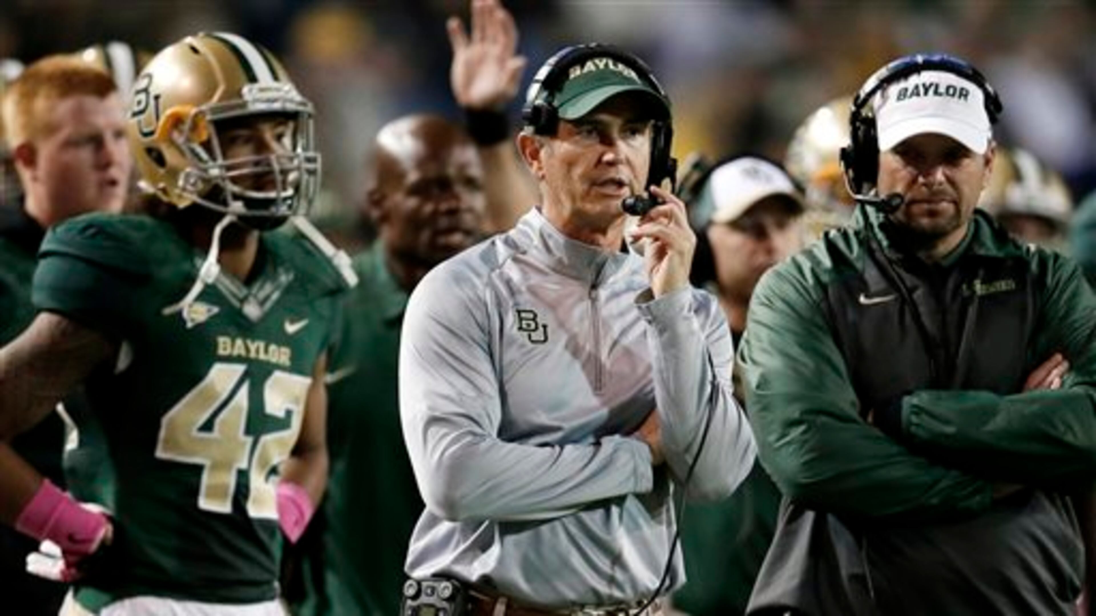 FILE - In this Oct. 19, 2013, file photo, Baylor head coach Art Briles, center, watches during the second half of an NCAA college football game against Iowa State in Waco, Texas. Baylor University's board of regents says it will fire Briles and re-assign university President Kenneth Starr in response to questions about its handling of sexual assault complaints against players. The university said in a statement Thursday, May 26, 2016, that it had suspended Briles "with intent to terminate." Starr will leave the position of president on May 31, but the school says he will serve as chancellor. (AP Photo/Tony Gutierrez, File)