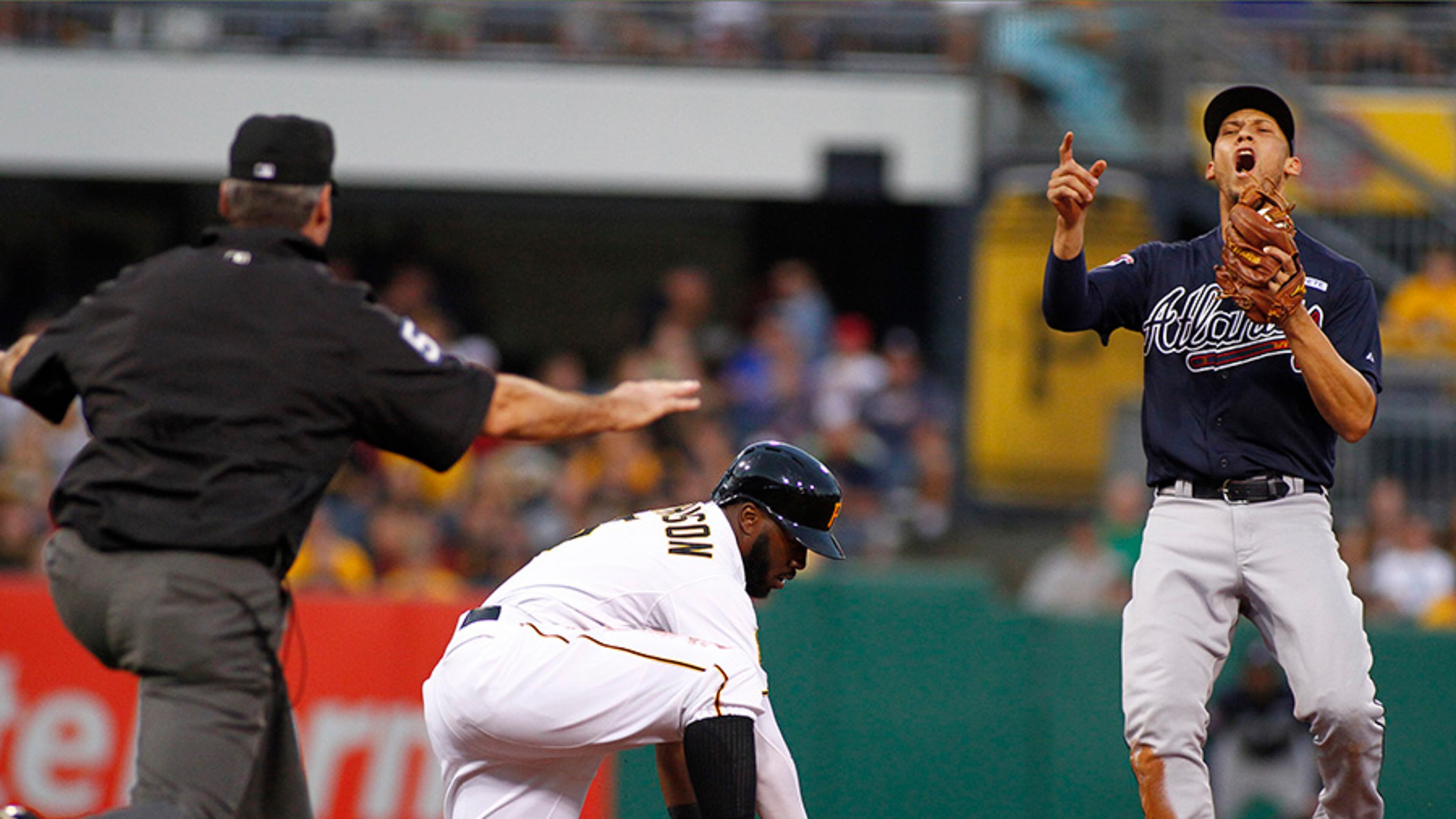 Braves shortstop Andrelton Simmons complains after second base umpire Angel Hemandez calls Josh Harrison safe on a pick off play in the first inning of the Braves' 3-2 loss Wednesday in Pittsburgh.