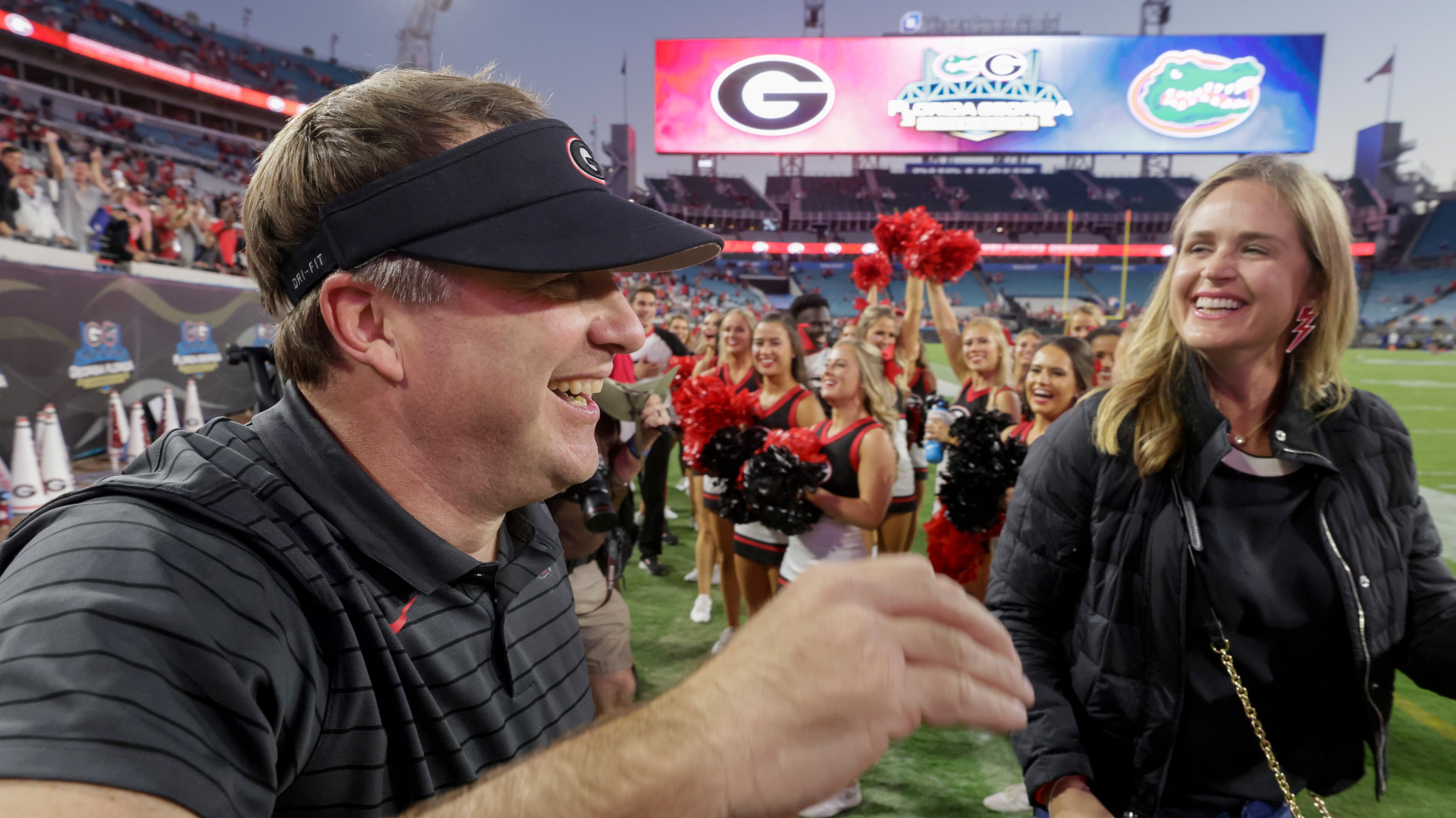 10/30/21 - Jacksonville - Georgia Bulldogs head coach Kirby Smart with his wife, Mary Beth, after the annual NCCA Georgia vs Florida game at TIAA Bank Field in Jacksonville. Georgia won 34-7. Bob Andres / bandres@ajc.com