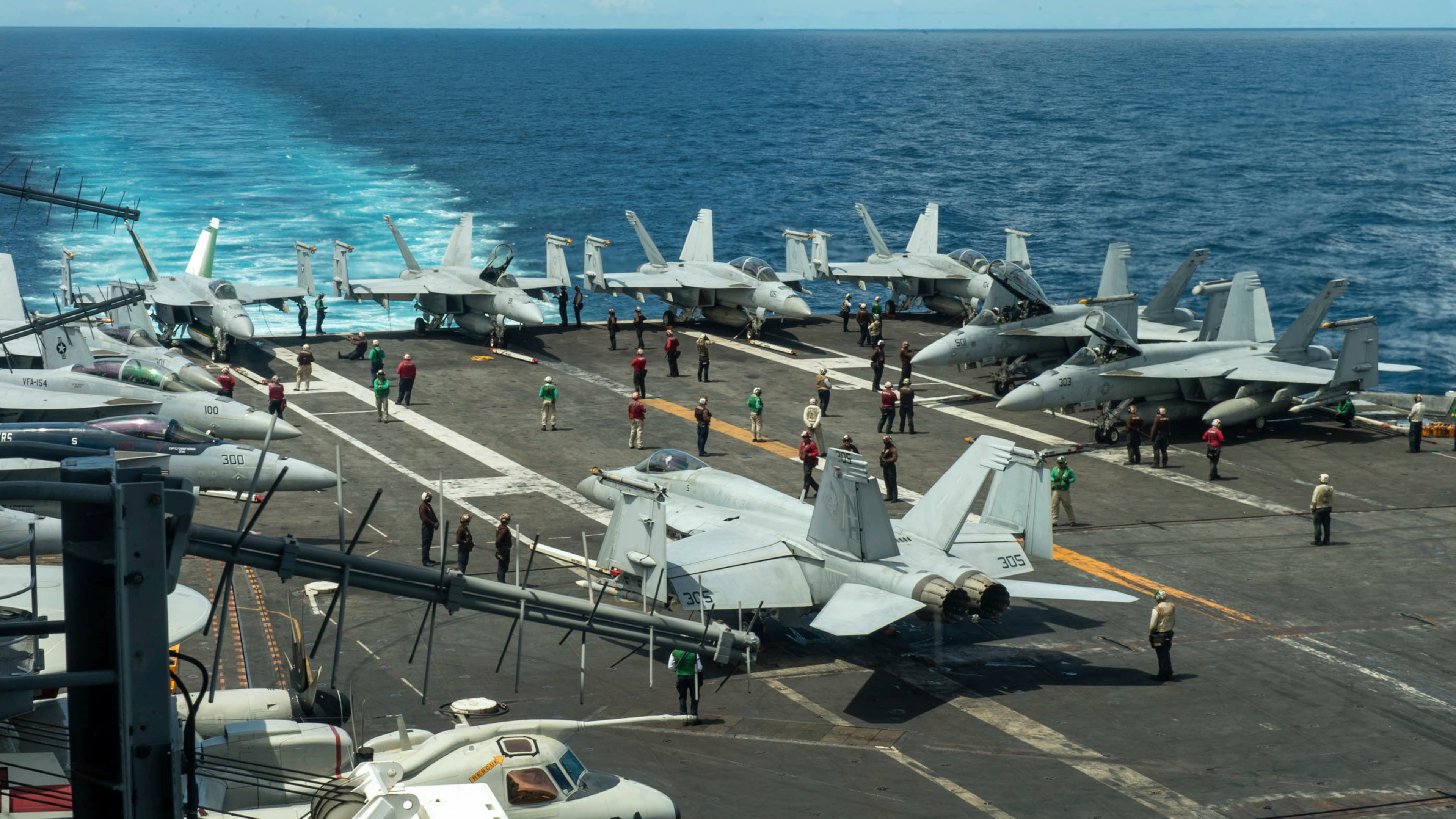 FILE - In this photograph released by the U.S. Navy, military planes stand on the flight deck of the Nimitz-class aircraft carrier USS Theodore Roosevelt, July 4, 2024, in the South China Sea. (Seaman Ryan Holloway/U.S. Navy, via AP, File)