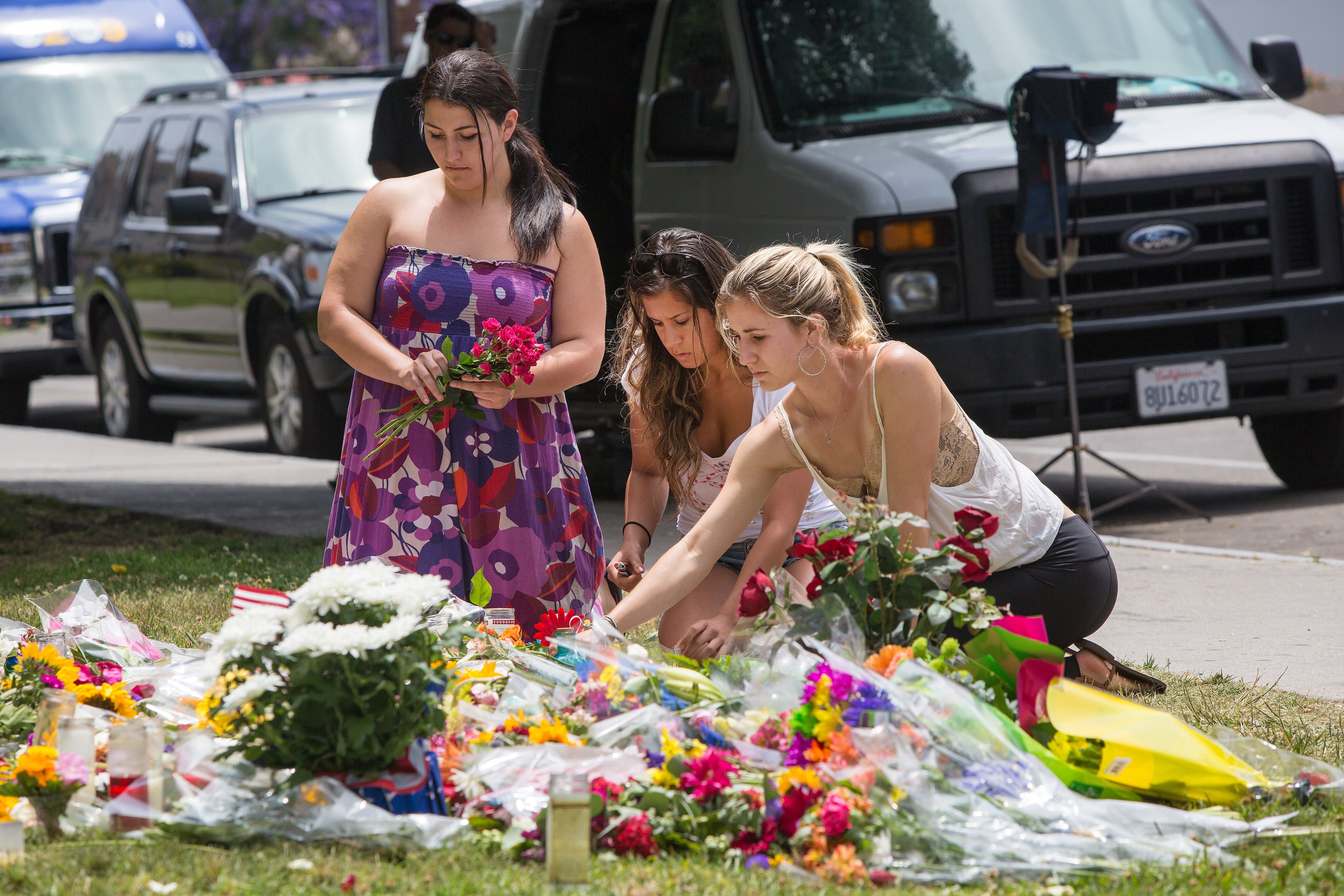 Women add to the makeshift memorial at the Alpha Phi sorority house where two women were shot and killed by Elliot Rodger during his shooting rampage on Friday in Isla Vista, Calif., May 26, 2014. All six of those killed by Rodger were students at the University of California, Santa Barbara. (Monica Almeida/The New York Times)