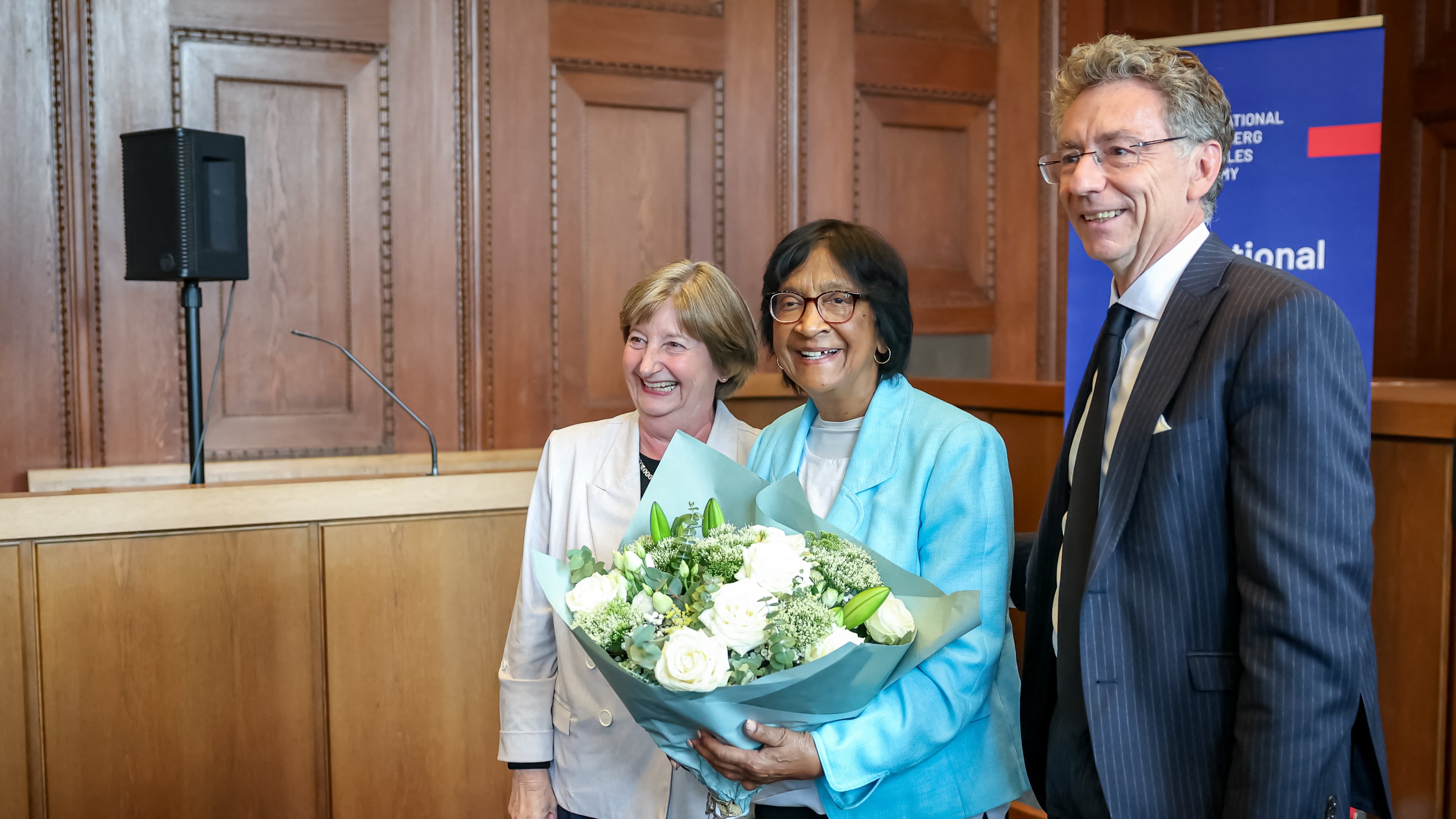 South African-born jurist and former U.N. human rights chief Navanethem "Navi" Pillay, center, poses with the former president of the International Criminal Court (ICC), Silvia Fernández de Gurmendi, and the director of the International Academy of the Nuremberg Principles, Christoph Safferling, at the Nuremberg Forum in Nuremberg, Germany, Friday, Oct. 9, 2026, following the announcement that she had been awarded the 2026 Nobel Peace Prize. (Daniel Karmann/dpa via AP)