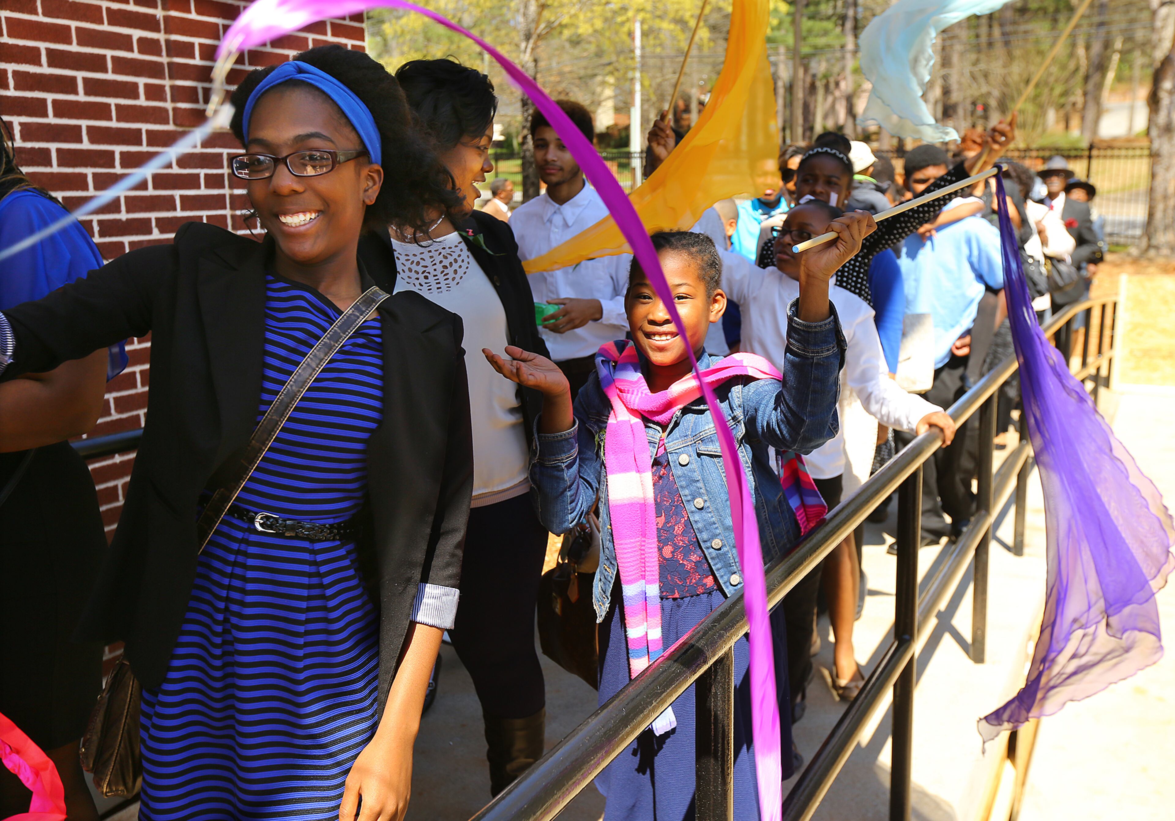 Children wave banners during the Entrance Service at Mount Vernon Baptist Church on Palm Sunday, March 29, 2015, in Atlanta. The church moved locations to make way for the Falcons new stadium. Curtis Compton / ccompton@ajc.com