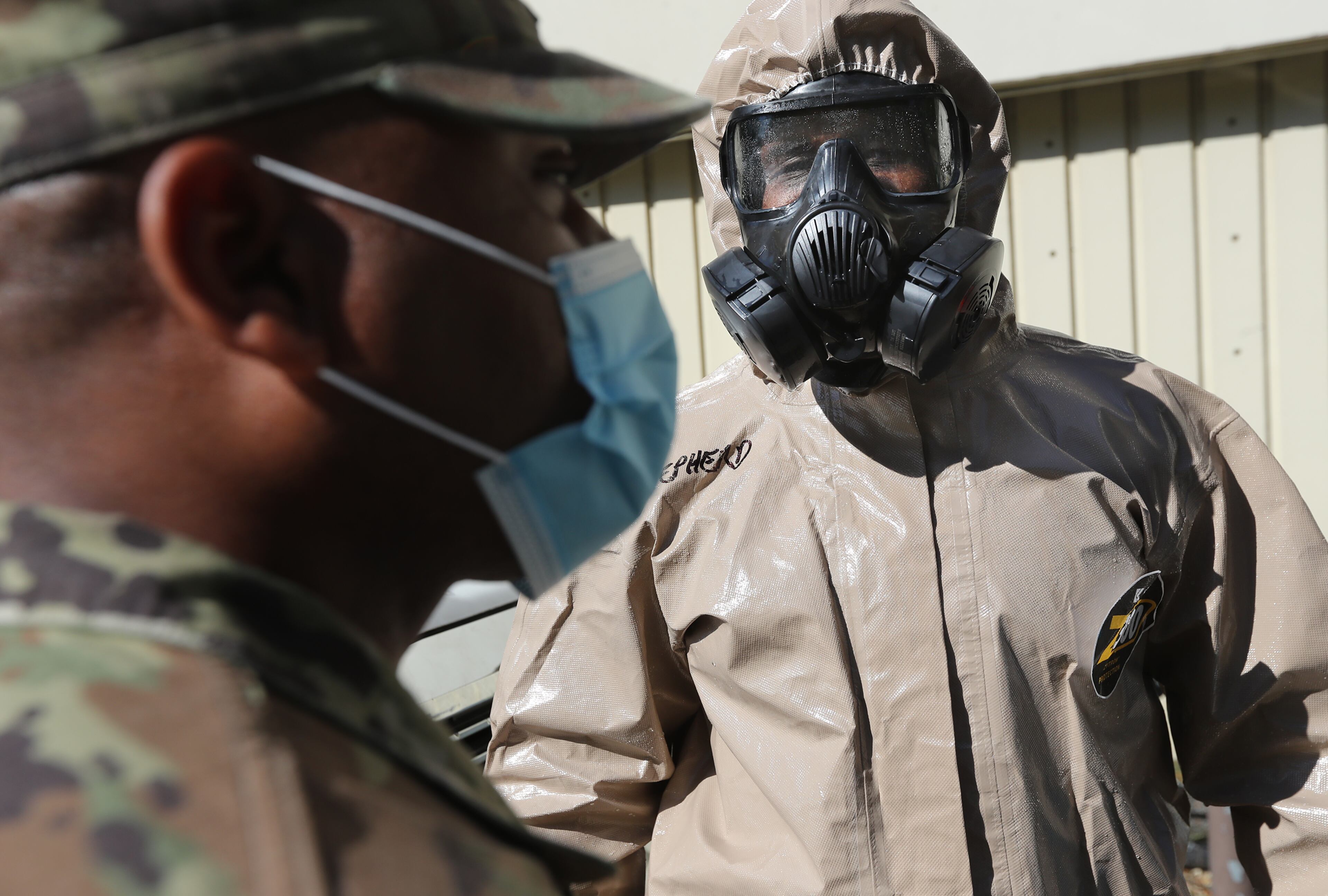 *** DO NOT RUN ONLINE OR PUBLISH UNTIL STORY RUNS *** April 21, 2020 Sandy Springs: Lt. Cameron Shepherd (right) confers with SSG Craig Robinson while leading 3 teams from the 265th Chemical Battalion disinfecting Campbell-Stone retirement community on Tuesday, April 21, 2020, in Sandy Springs. Curtis Compton ccompton@ajc.com
