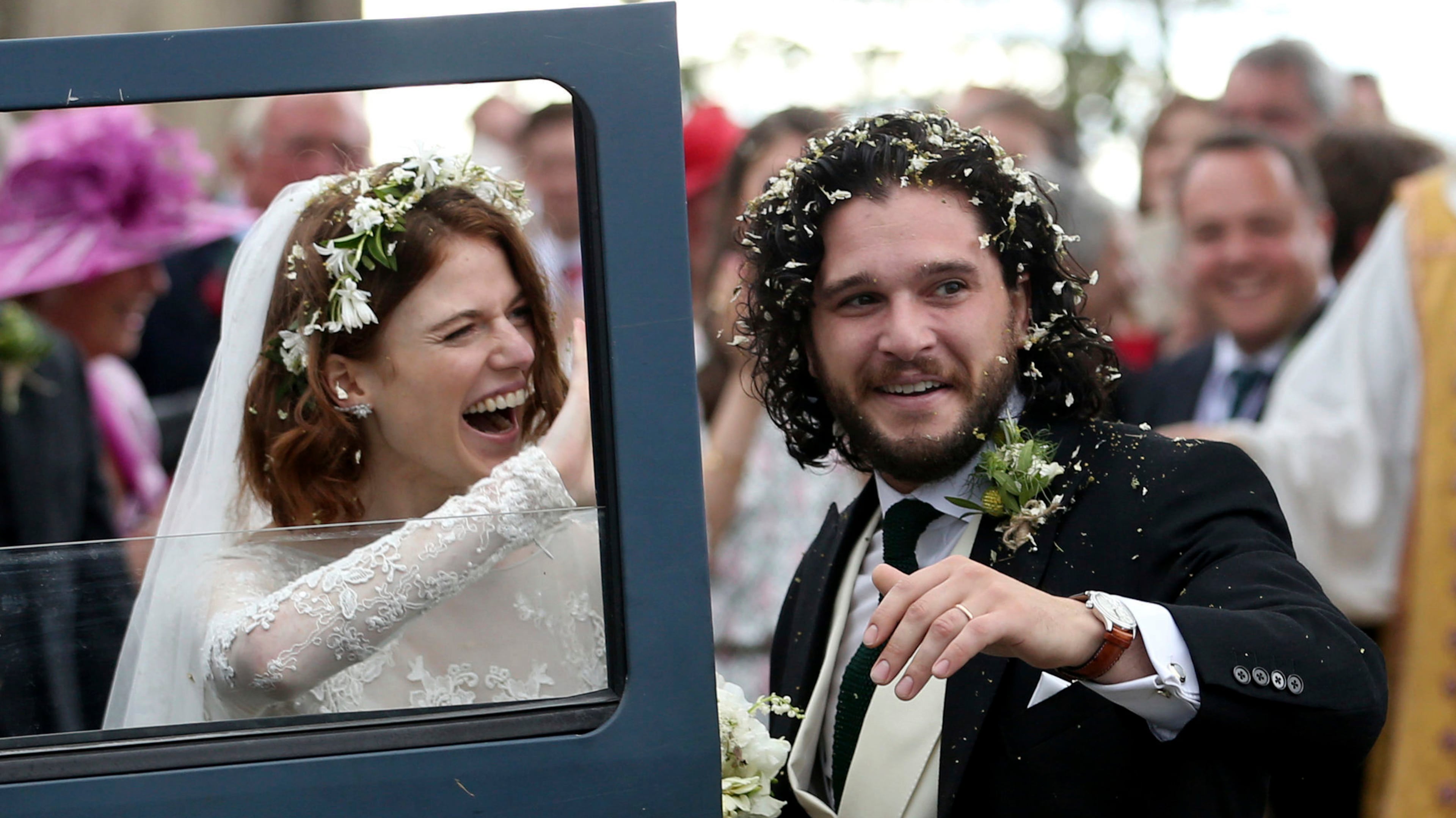'Game of Thrones' actors Kit Harington and Rose Leslie celebrate as they leave after their wedding ceremony, at Rayne Church, Kirkton of Rayne in Aberdeenshire, Scotland, Saturday June 23, 2018.