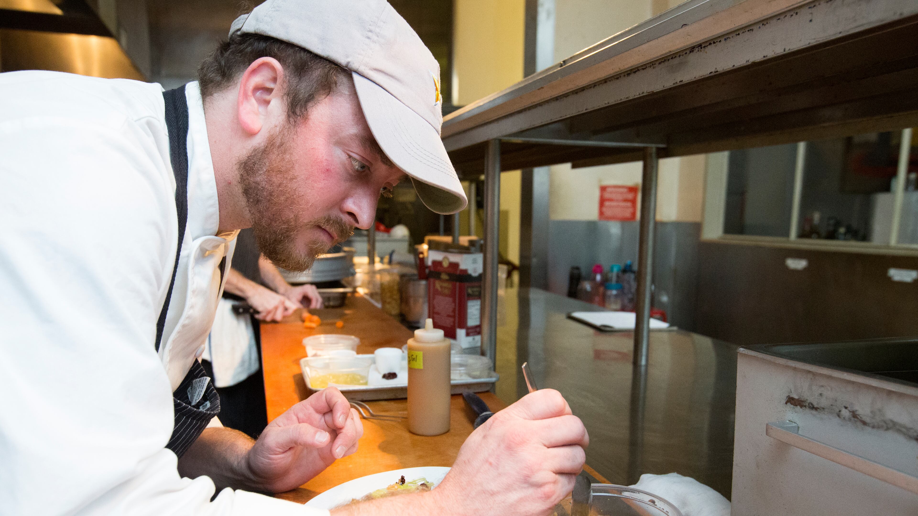 Chef David Carson crafts his price fixe menu at Bacchanalia.