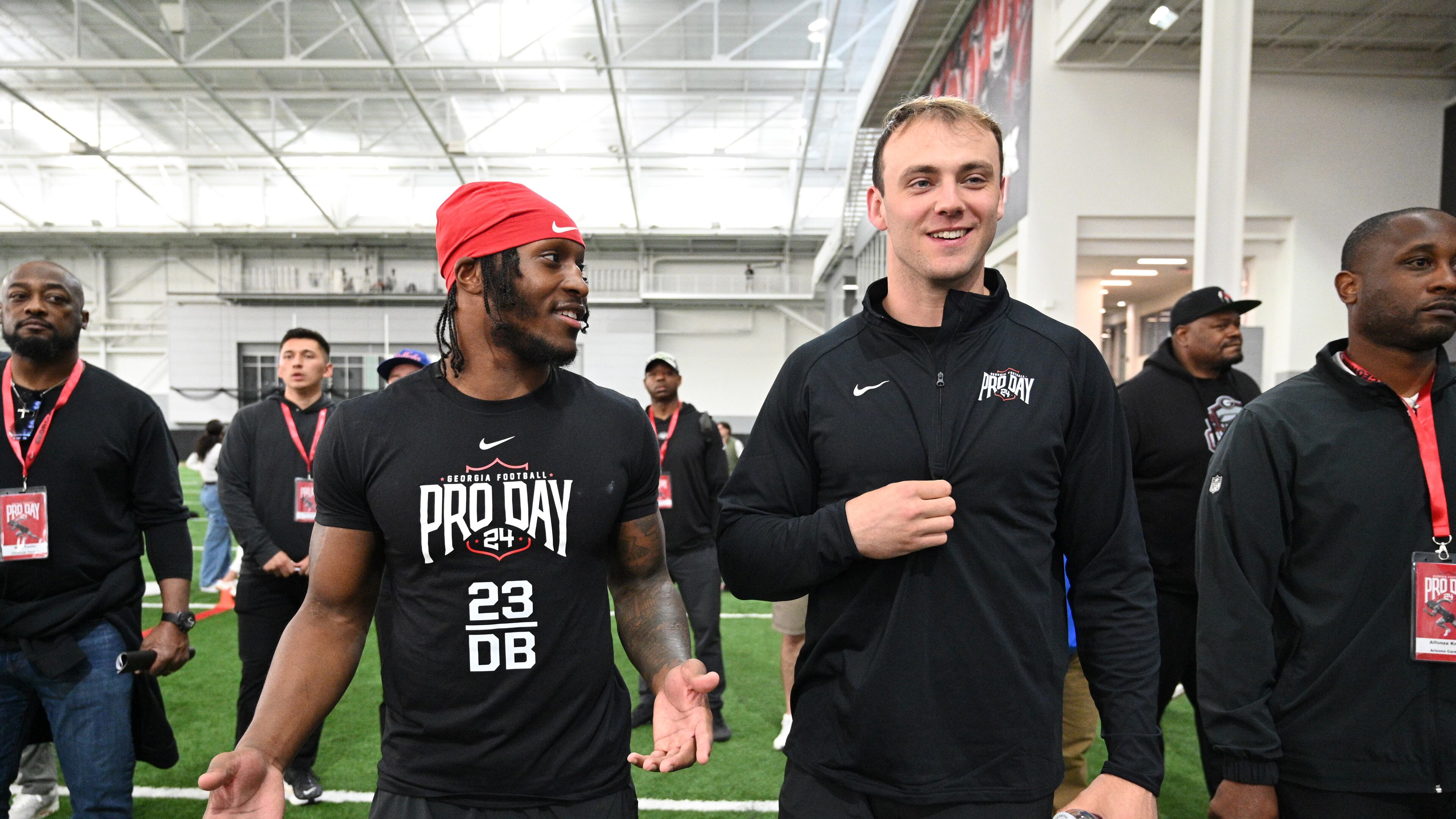 Georgia defensive back Tykee Smith (left) and tight end Brock Bowers share a smile during Georgia Pro Day at Payne Indoor Athletic Facility, Wednesday, Mar. 13, 2024, in Athens. (Hyosub Shin / Hyosub.Shin@ajc.com)