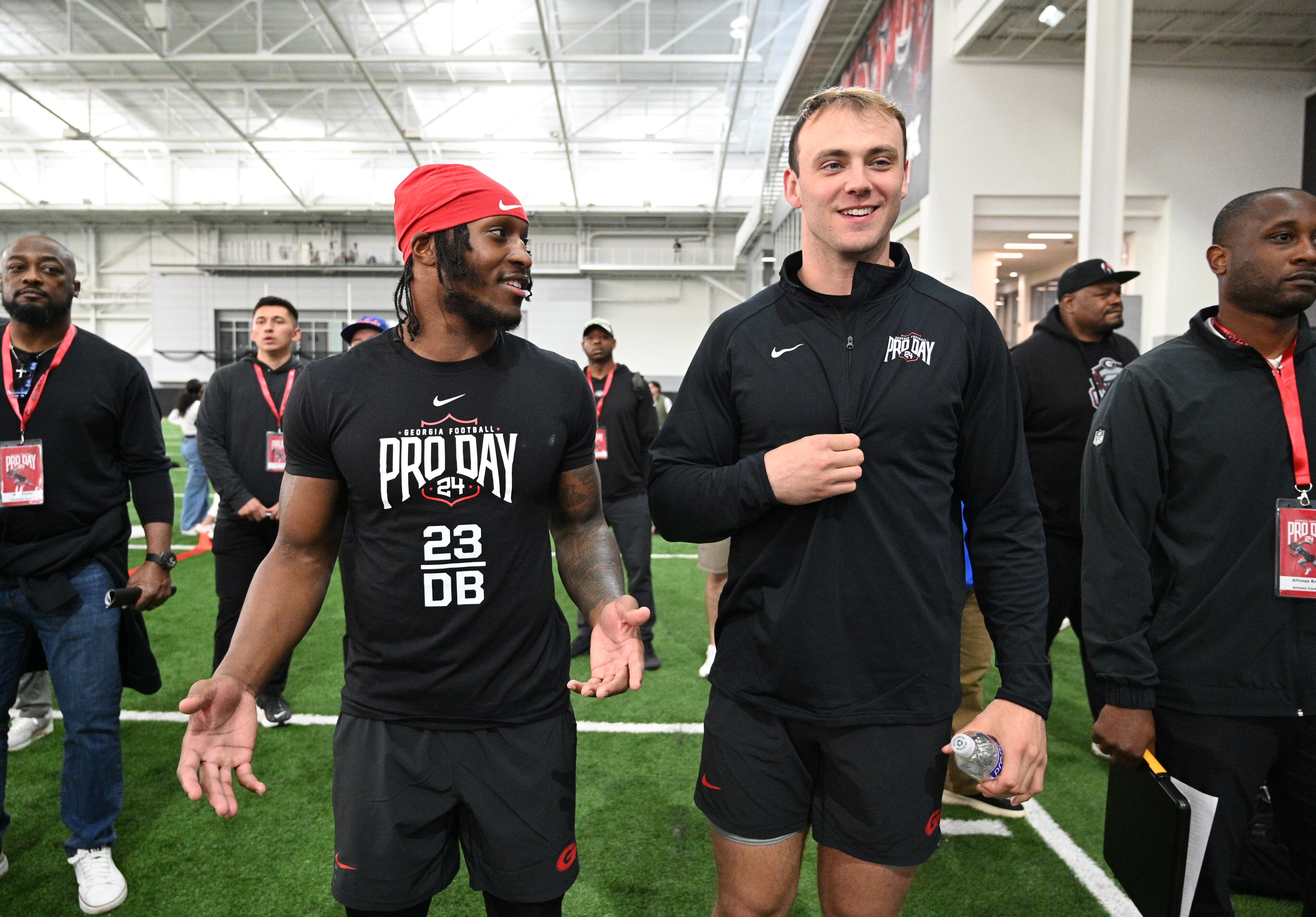 Georgia defensive back Tykee Smith (left) and tight end Brock Bowers share a smile during Pro Day. (Hyosub Shin / Hyosub.Shin@ajc.com)
