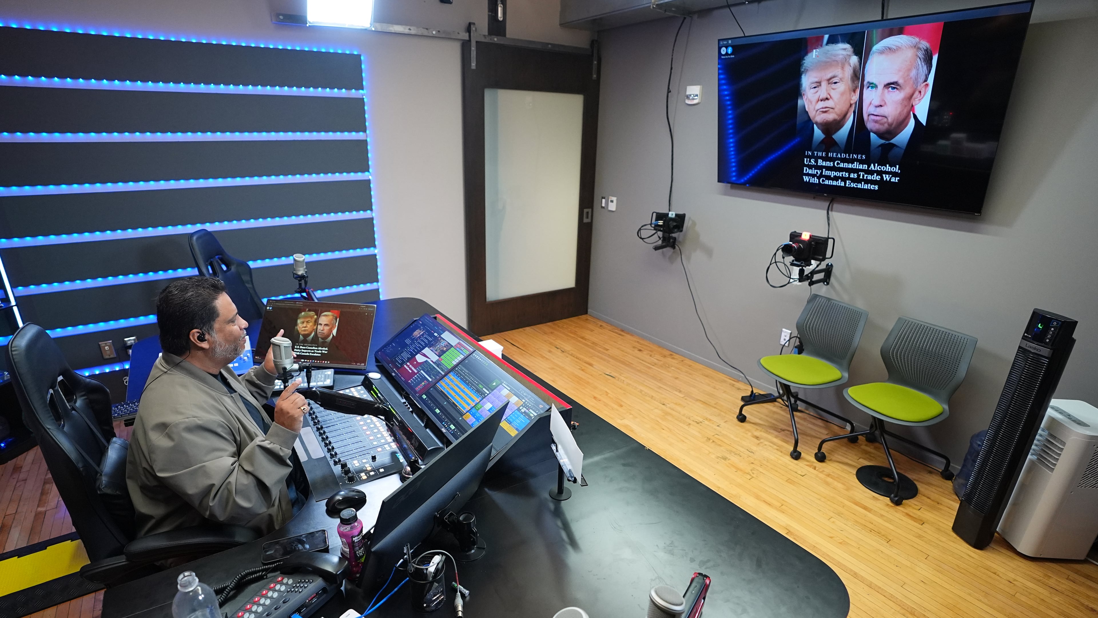 Victor Martinez, who runs La Mega 101.7, a Spanish-language radio station in Pennsylvania's Lehigh Valley, hosts a politics talk show from his studio in Allentown, Pa., on Sept. 29, 2026. (AP Photo/Matt Rourke)