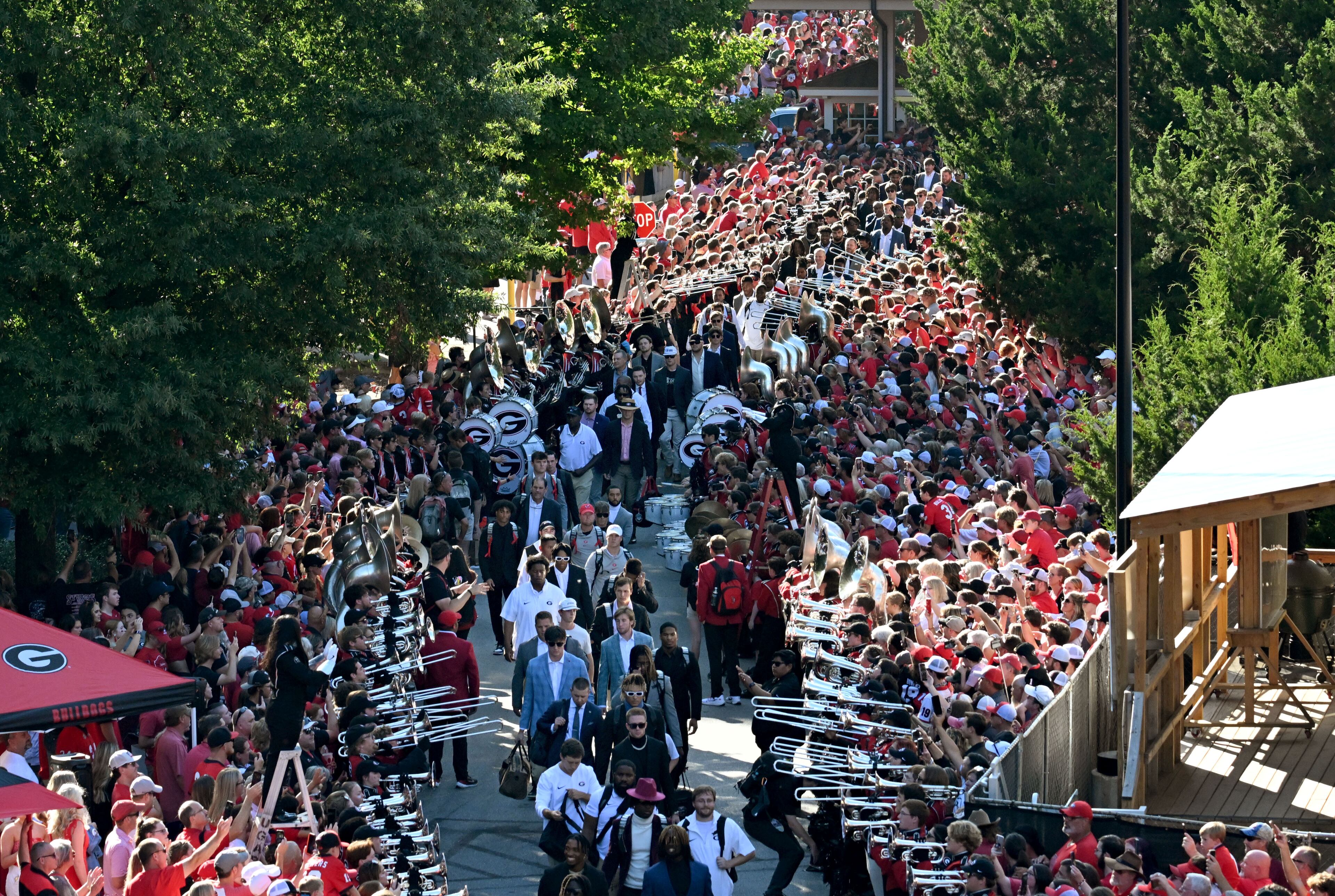 Georgia players and coaching staff participate in the Dawg Walk before their home game against the UAB at Sanford Stadium, Saturday, September 23, 2023, in Athens. (Hyosub Shin / Hyosub.Shin@ajc.com)