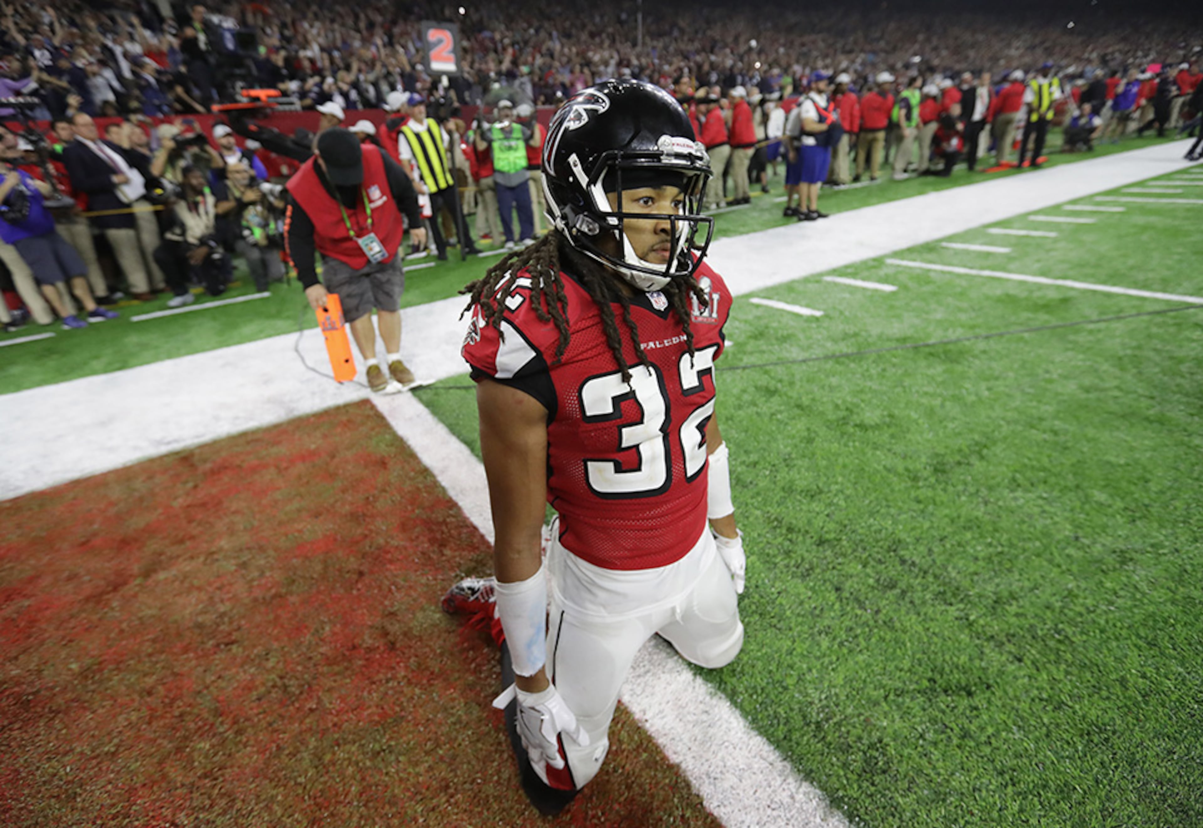 Atlanta Falcons cornerback Jalen Collins kneels in shock after the New England Patriots' defeat the Falcons 34-28 in overtime at the Super Bowl Sunday, Feb. 5, 2017, at NRG Stadium in Houston.