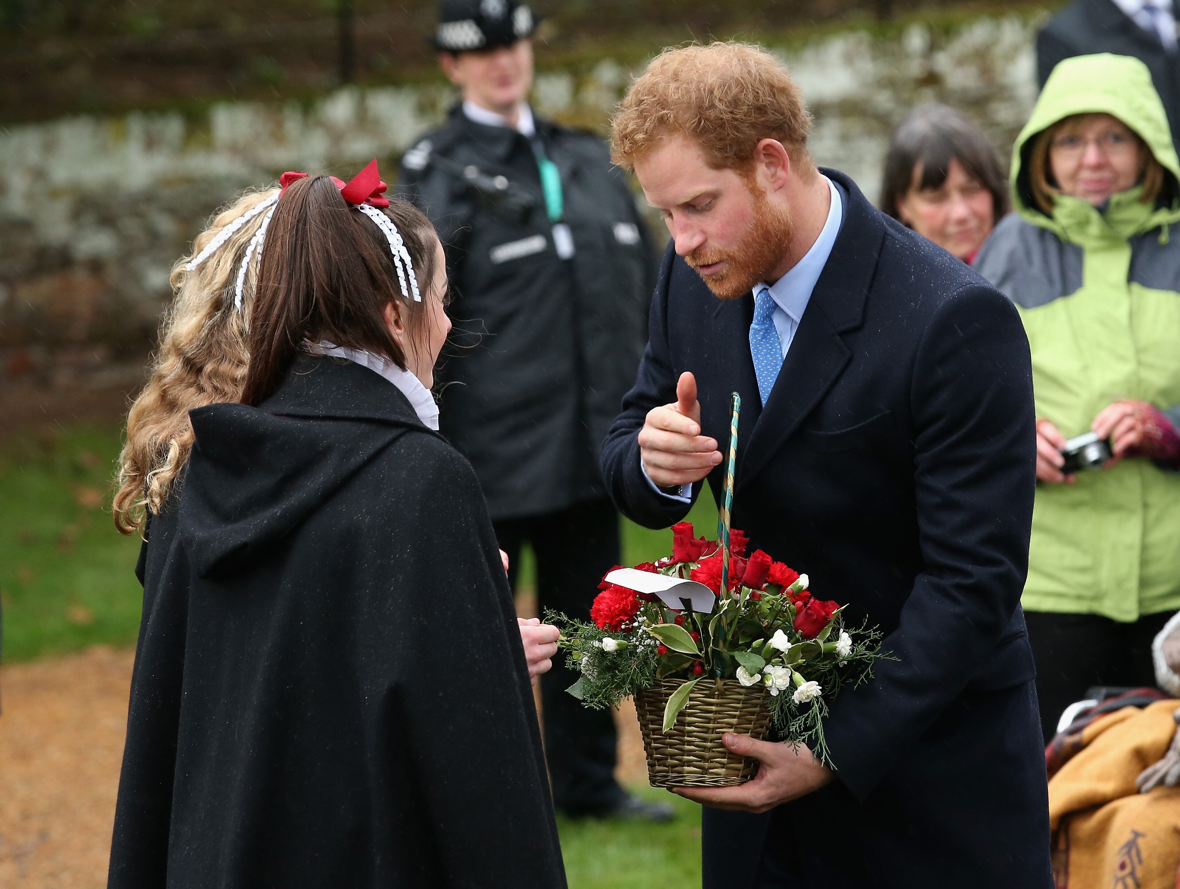 KING'S LYNN, ENGLAND - DECEMBER 25: Prince Harry meets members of the public as he attends a Christmas Day church service at Sandringham on December 25, 2015 in King's Lynn, England. (Photo by Chris Jackson/Getty Images)