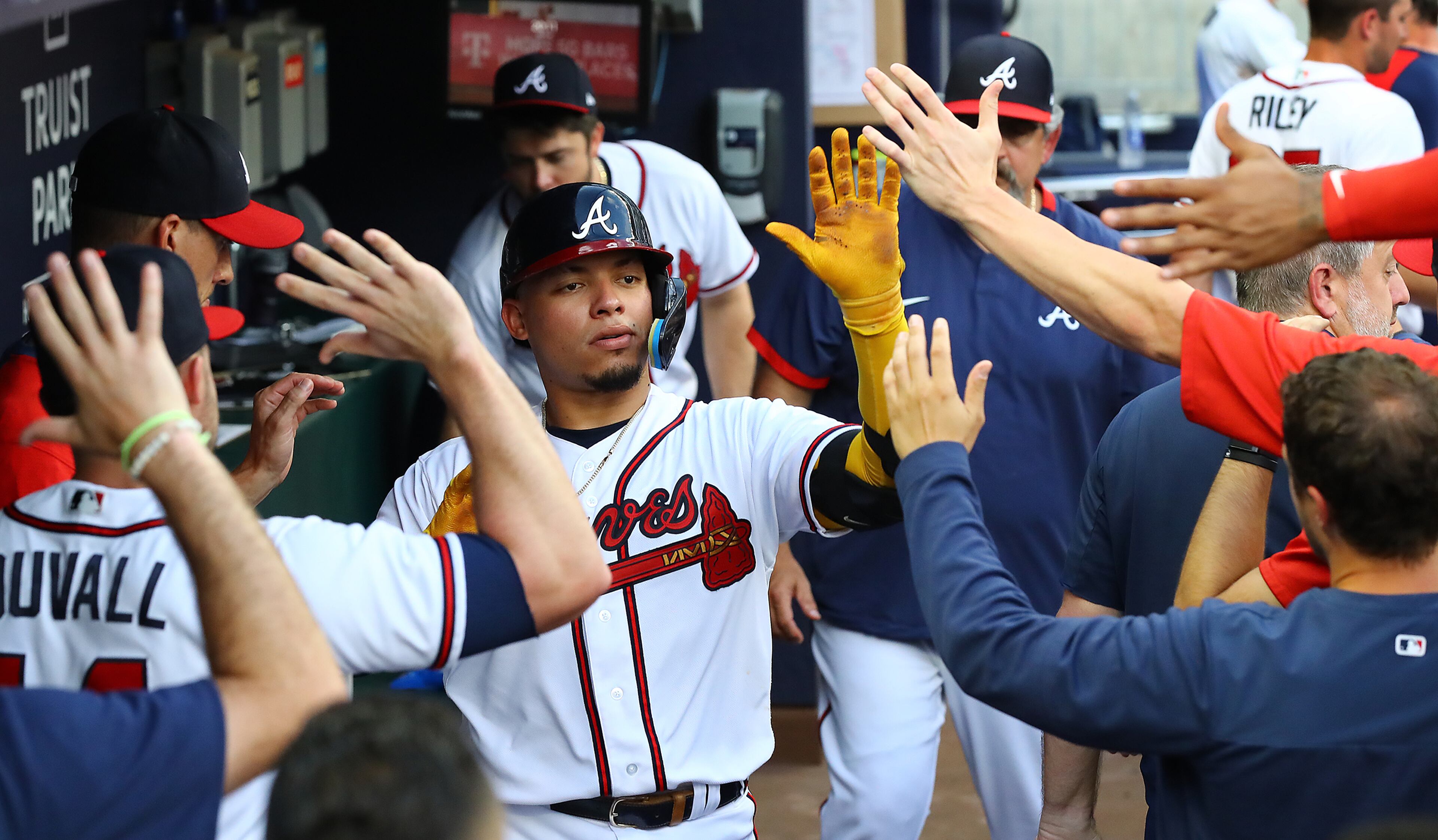 Braves catcher William Contreras gets high fives in the dugout hitting a 2-RBI home run to take a 5-1 lead over the St. Louis Cardinals during the first inning in a MLB baseball game on Tuesday, July 5, 2022, in Atlanta. “Curtis Compton / Curtis.Compton@ajc.com”