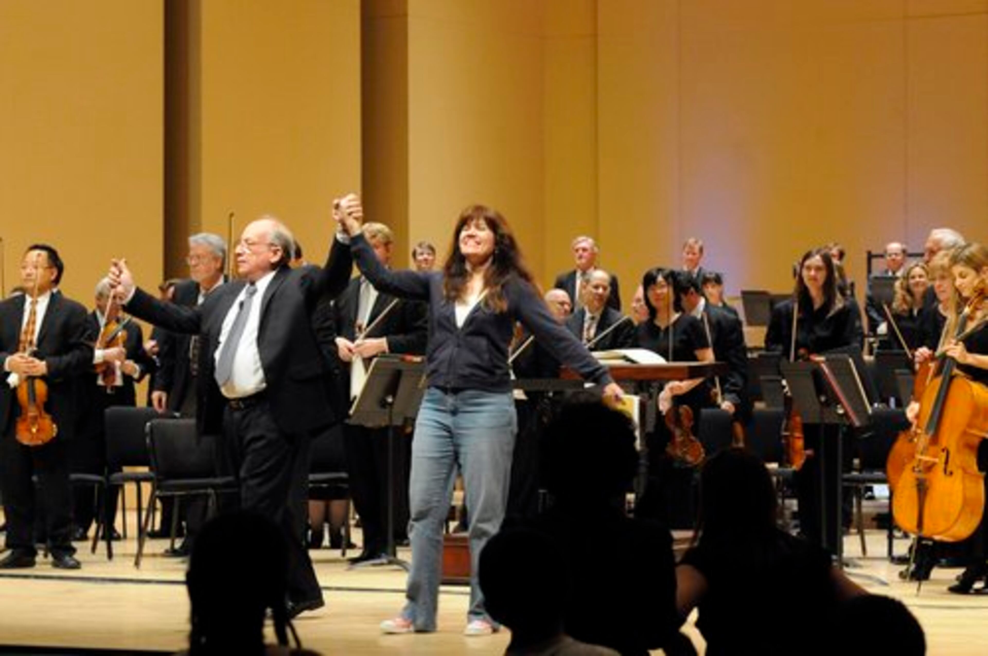Conductor Jere Flynt and vocalist Wendy Bennett take a bow with the Atlanta Symphony Orchestra following a Discover Next Generation concert during the Target Free Family Day at the Woodruff Arts Center Sunday afternoon. Kent D. Johnson, kdjohnson@ajc.com