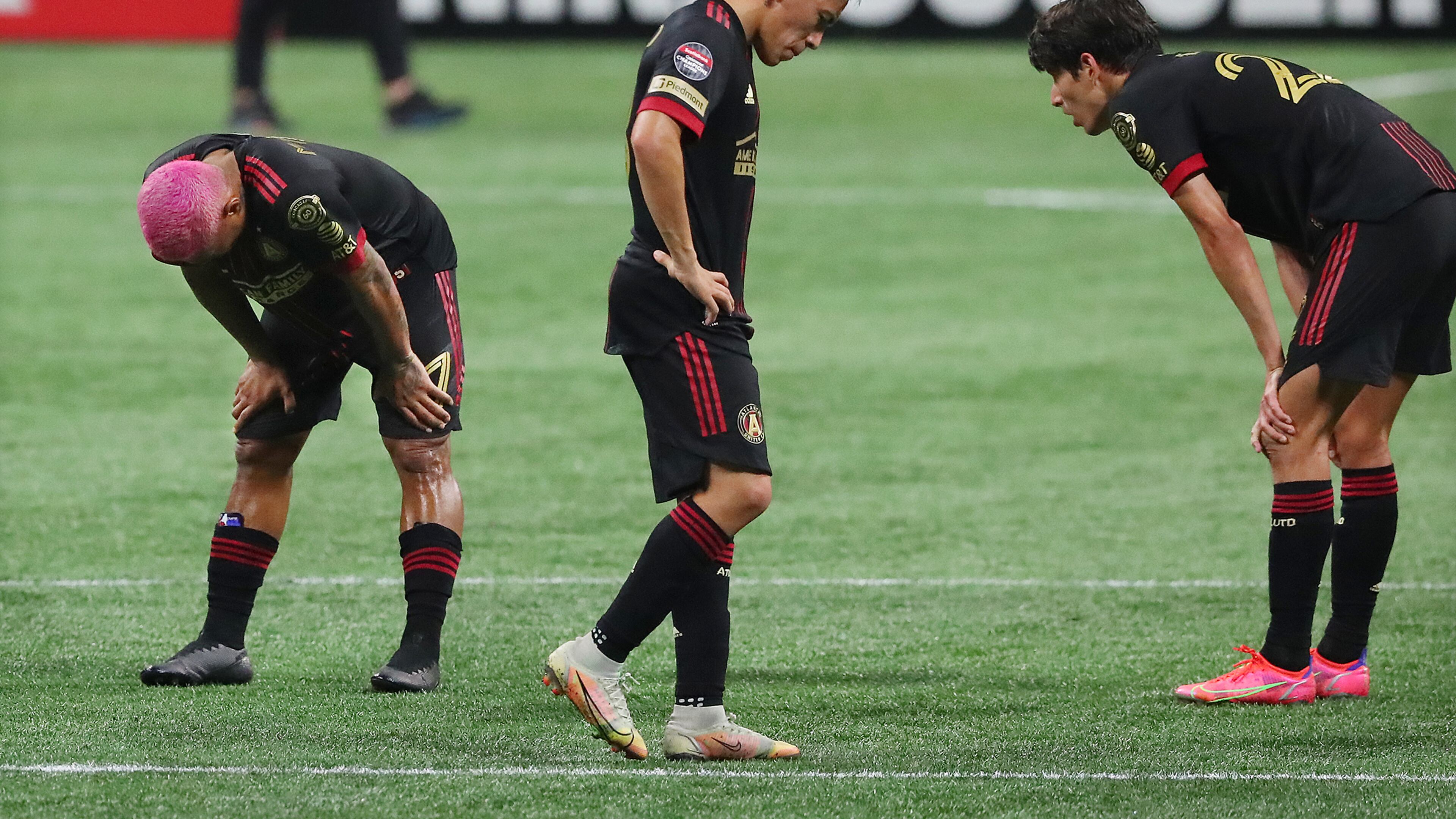 Atlanta United players Josef Martinez (from left), Ezequiel Barco and Jurgen Damm react as time expires to falling 3-0 to the Philadelphia Union in the first leg of the CONCACAF Champions League quarterfinals Tuesday, April 27, 2021, at Mercedes-Benz Stadium in Atlanta. (Curtis Compton / Curtis.Compton@ajc.com)