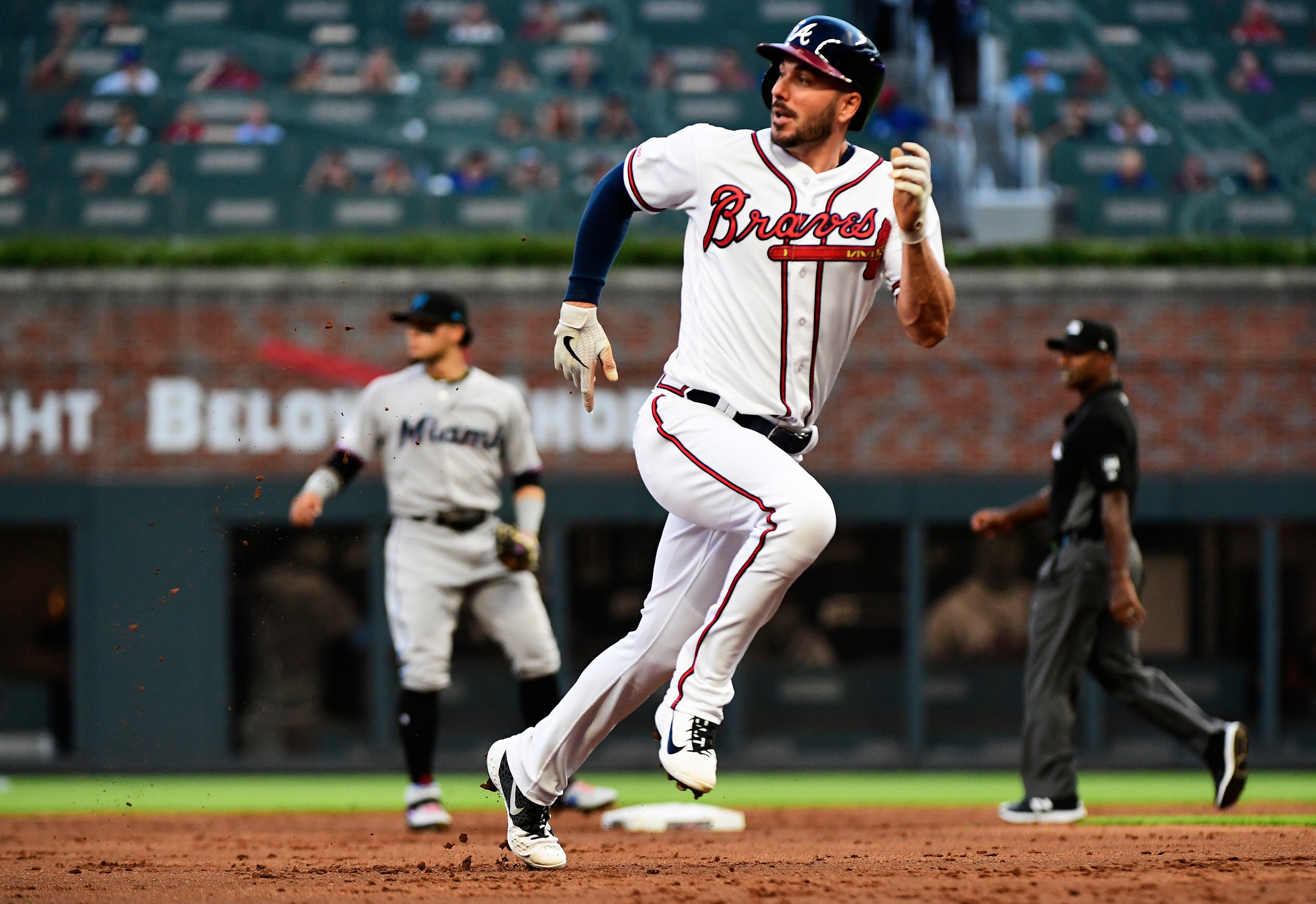 Matt Joyce #14 of the Atlanta Braves runs to third base in the third inning against the Miami Marlins at SunTrust Park on August 22, 2019 in Atlanta, Georgia. (Photo by Logan Riely/Getty Images)