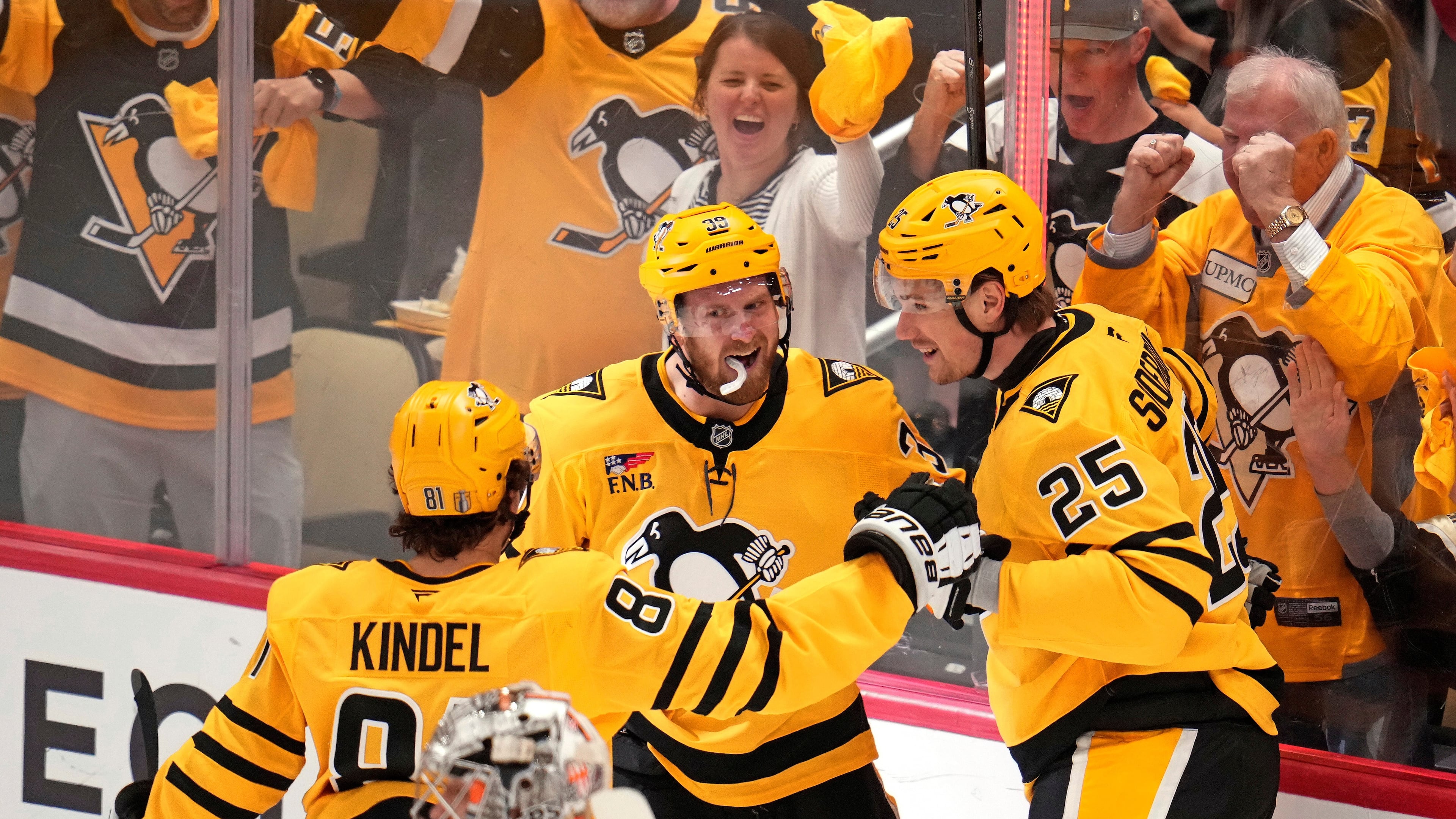 Pittsburgh Penguins' Elmer Soderblom (25) celebrates with Ben Kindel (81) and Anthony Mantha (39) after scoring against the Philadelphia Flyers during the first period of Game 5 in the first round of an NHL hockey Stanley Cup playoff series in Pittsburgh, Monday, April 27, 2026. (AP Photo/Gene J. Puskar)
