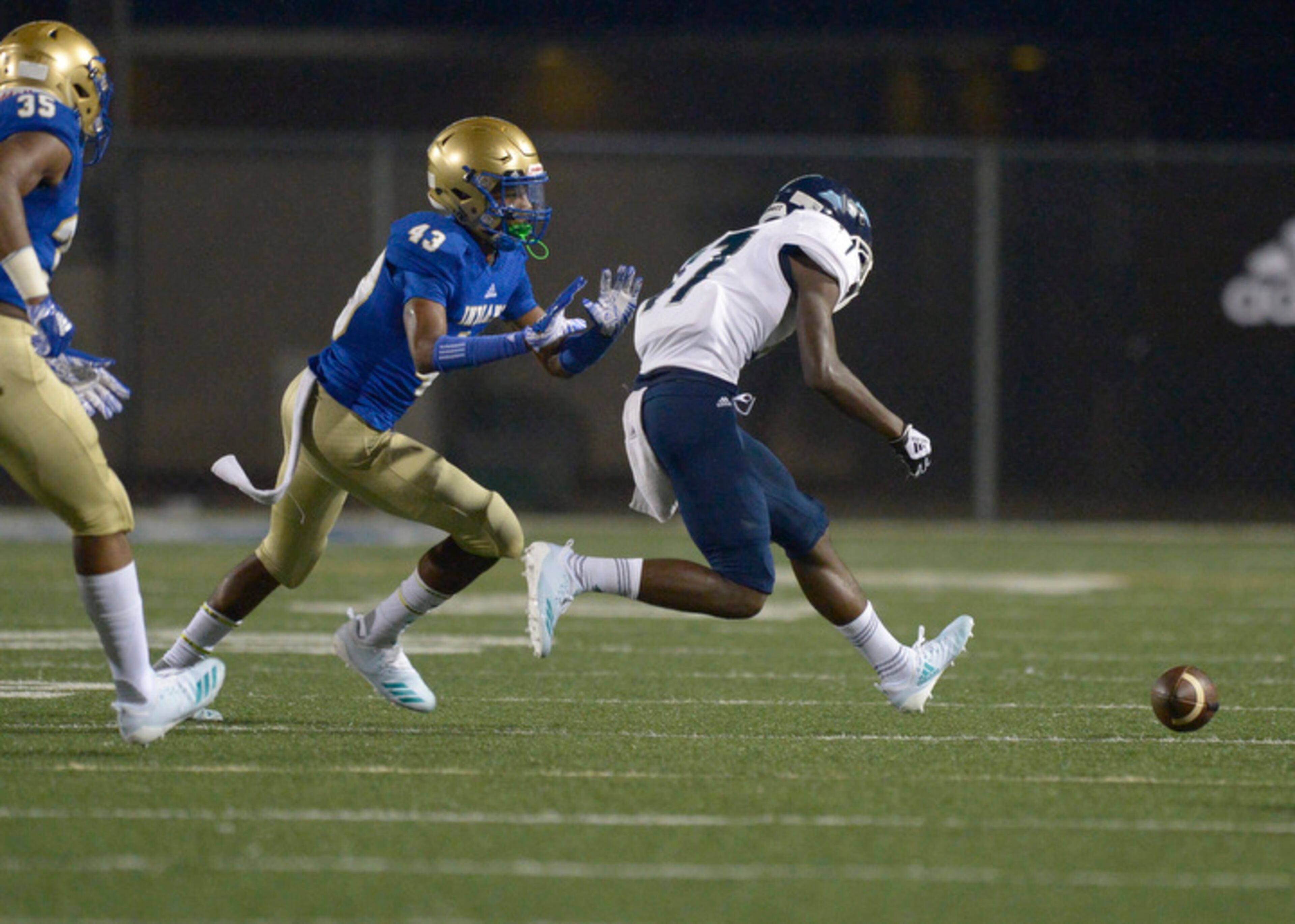 McEachern junior FS Jamari Bellamy (43) and Cedar Grove senior Demetri Cooper (17) scramble for a loose ball during Friday's game. (Daniel Varnado/Special)