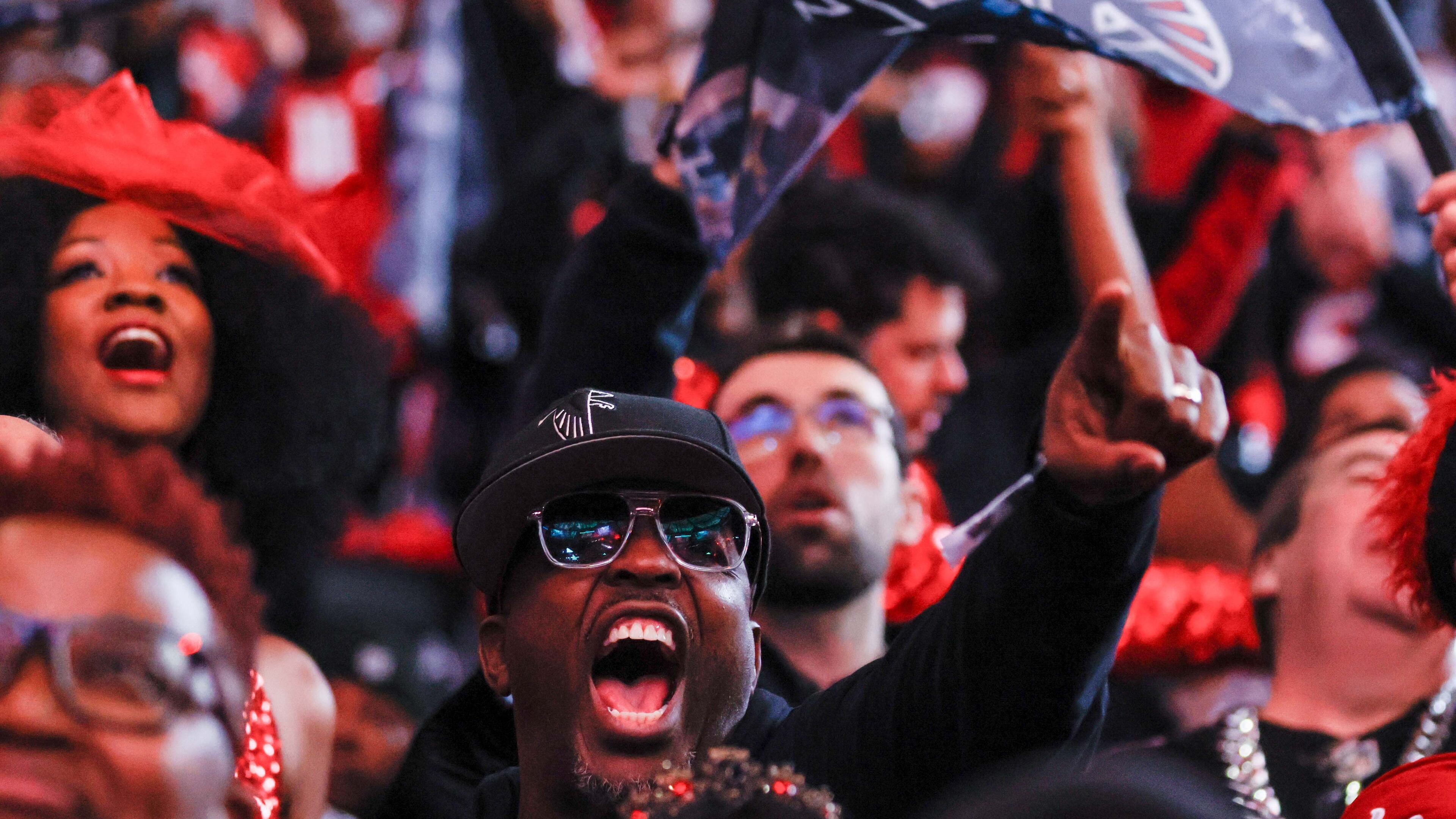 Falcons fans cheer during a game against the Los Angeles Chargers on Dec. 1, 2024, at Mercedes-Benz Stadium in Atlanta. (Miguel Martinez/AJC)