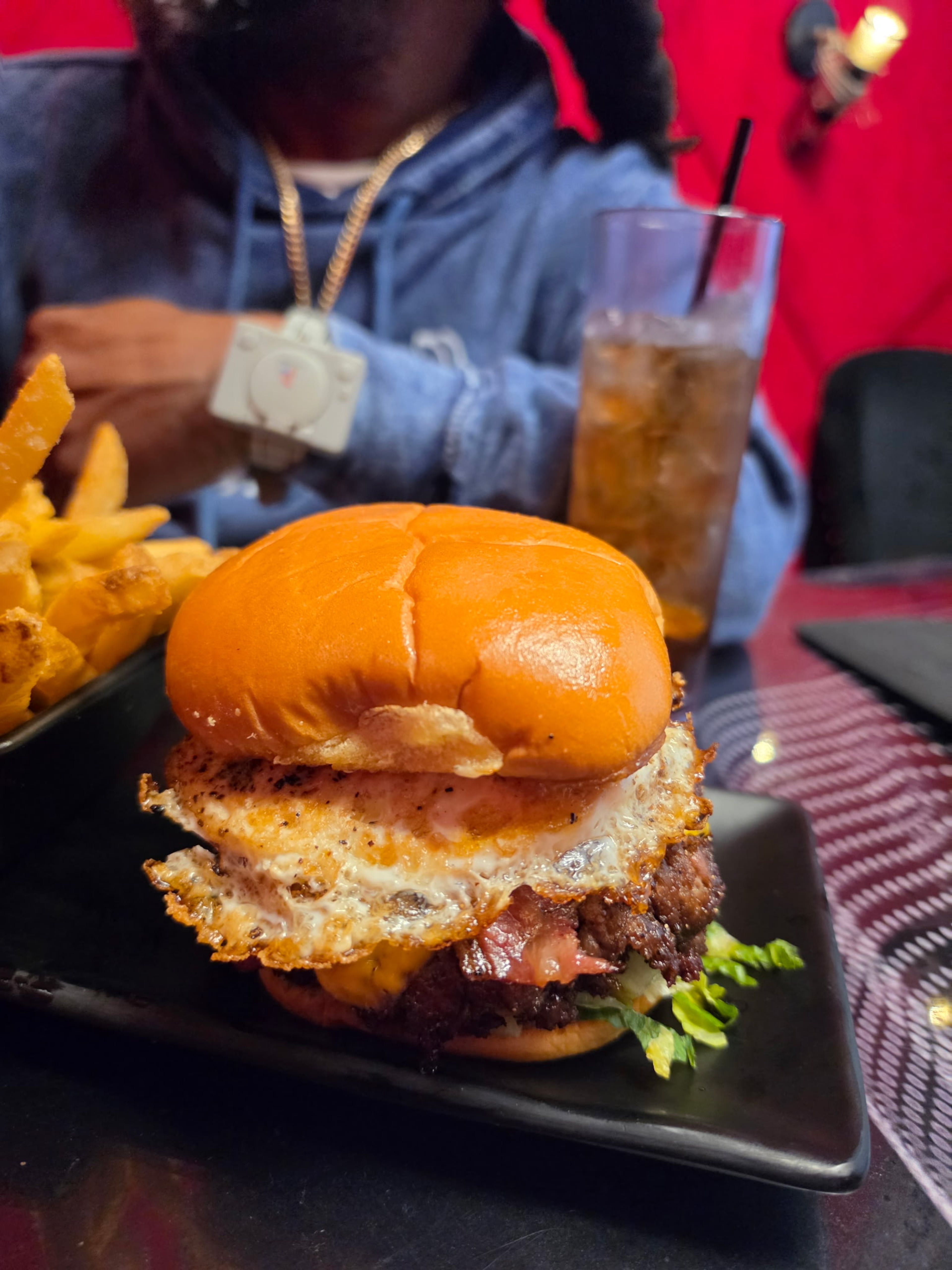 BOSK's big OOMP burger is topped with a fried egg and BOSK sauce. (Courtesy of Justin Brown)