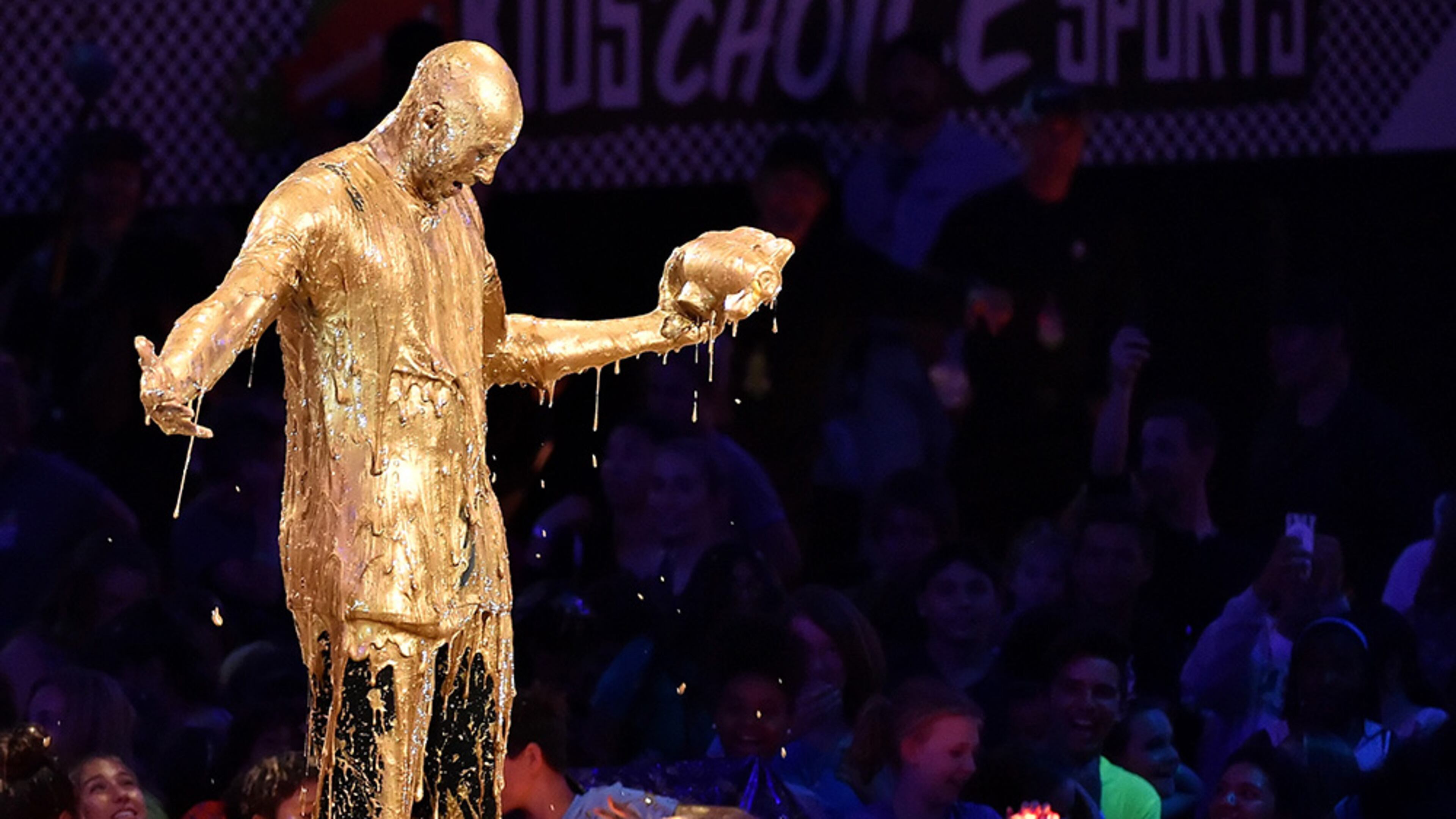 Retired NBA All-Star Kobe Bryant accepts the Legend Award and gets slimed onstage during the 2016 Nickelodeon Kids' Choice Sports Awards.
