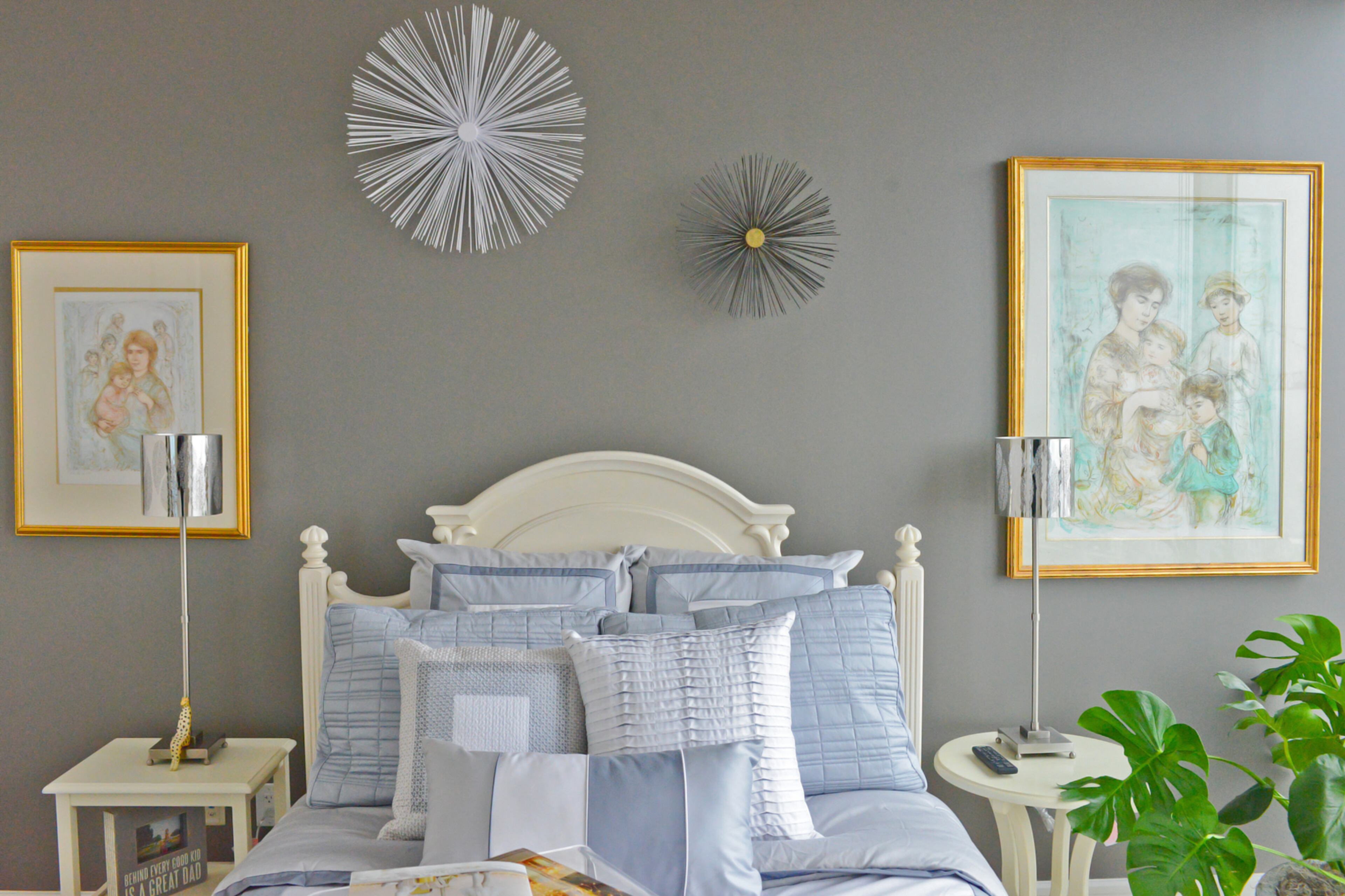 Grays and blues to create a peaceful sleeping area in the guest bedroom of the Midtown high-rise condo. Synergy wired all the electronics and window coverings in the home to be controlled with the touch of a button. The guest bedroom has its own separate system that visitors can control.