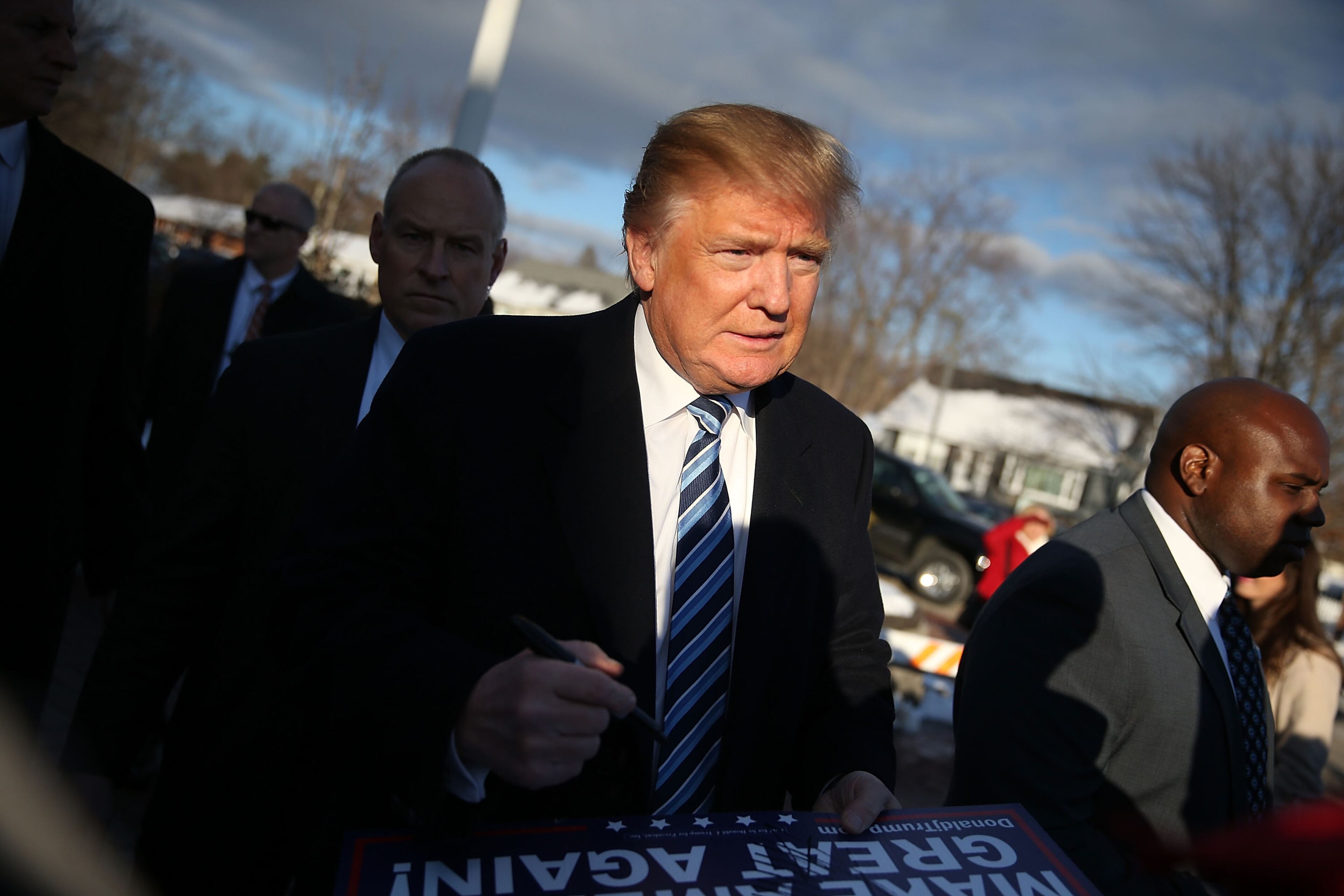 Republican presidential candidate Donald Trump greets people as he visits a polling station as voters cast their primary day ballots on February 9, 2016 in Manchester, New Hampshire. The process to select the next Democratic and Republican Presidential candidates continues. (Photo by Joe Raedle/Getty Images)