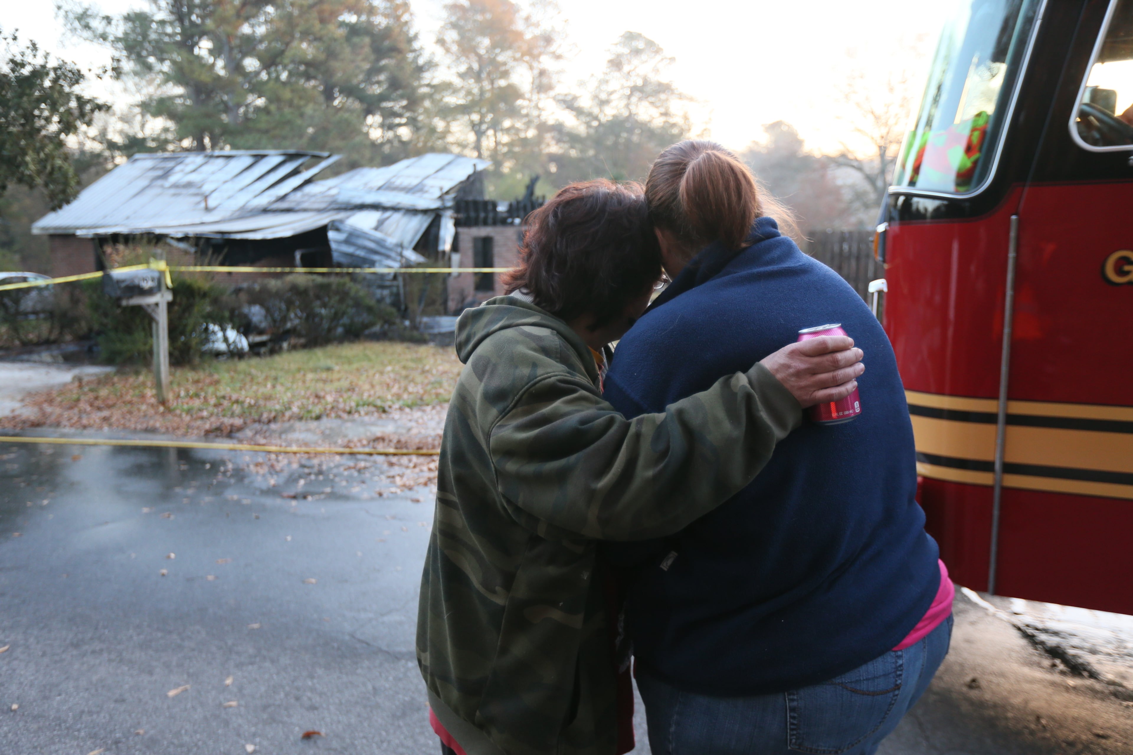 Family members embracing in front of the burned home were one person is dead following a fire late Sunday night in Lilburn. When Gwinnett County fire fighters arrived on scene, neighbors and police reported that an occupant was possibly still inside the burning home, Gwinnett County fire Capt. Tommy Rutledge said. Despite several challenges, fire fighters had the blaze under control in about 30 minutes.