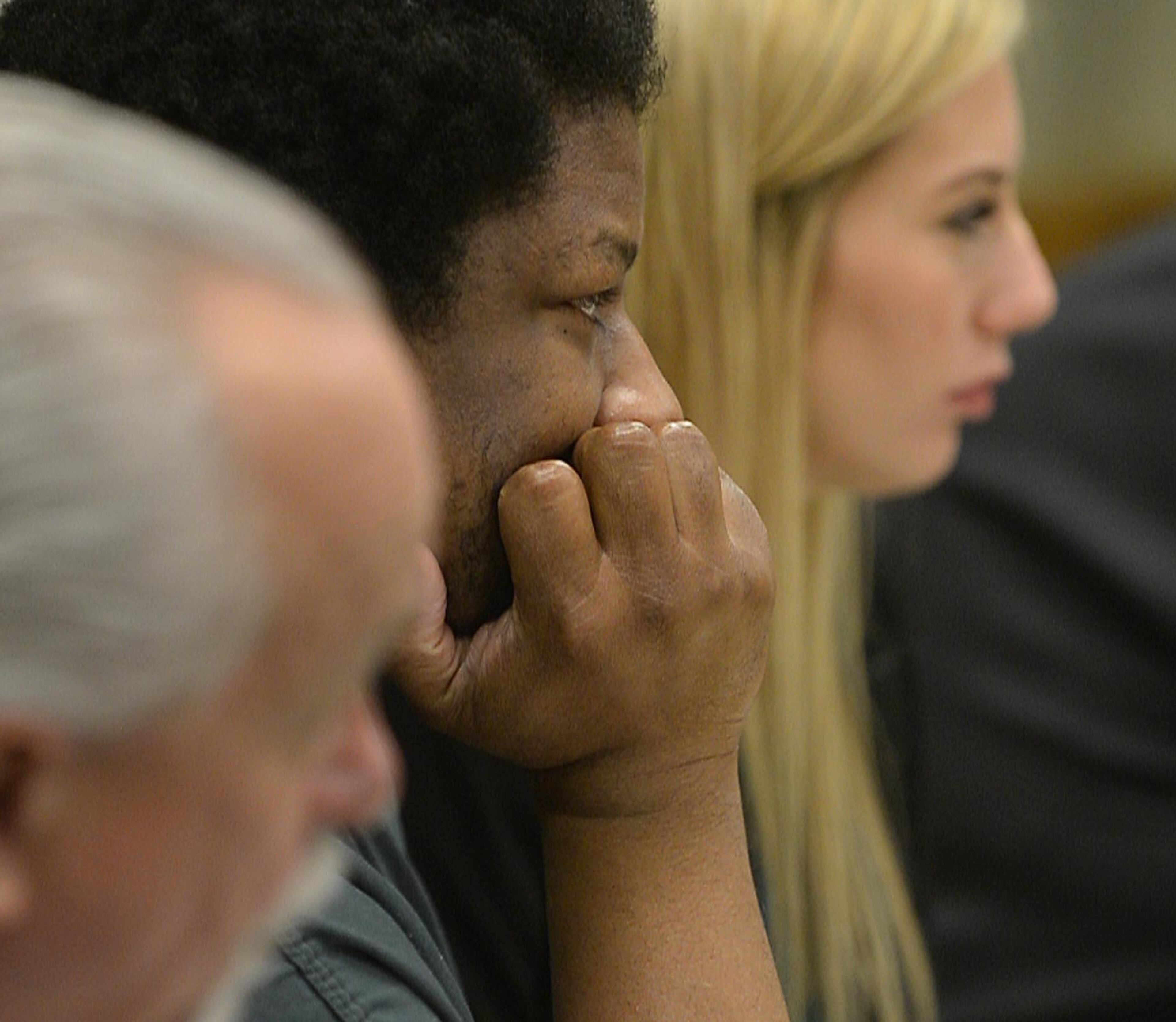 Calvin Mcintosh listens as GCPD Detective James Sweeney testifies. Chief Magistrate Kristina Hammer Blum presides over hearing for a Gwinnett man and his daughter who are charged with starving the man's child to death and withholding food from the child's 21-year-old mother, who weighed 59 pounds when she was found. Calvin Mcintosh and his daughter, Najlaa, appear in the probable cause hearing Friday, December 5, 2014. Judge Blum found there was probably cause for cruelty to children and murder charges and bound their case over to Superior Court. She said that due to the charges, the court did not have jurisdiction to set a bond. KENT D. JOHNSON/KDJOHNSON@AJC.COM